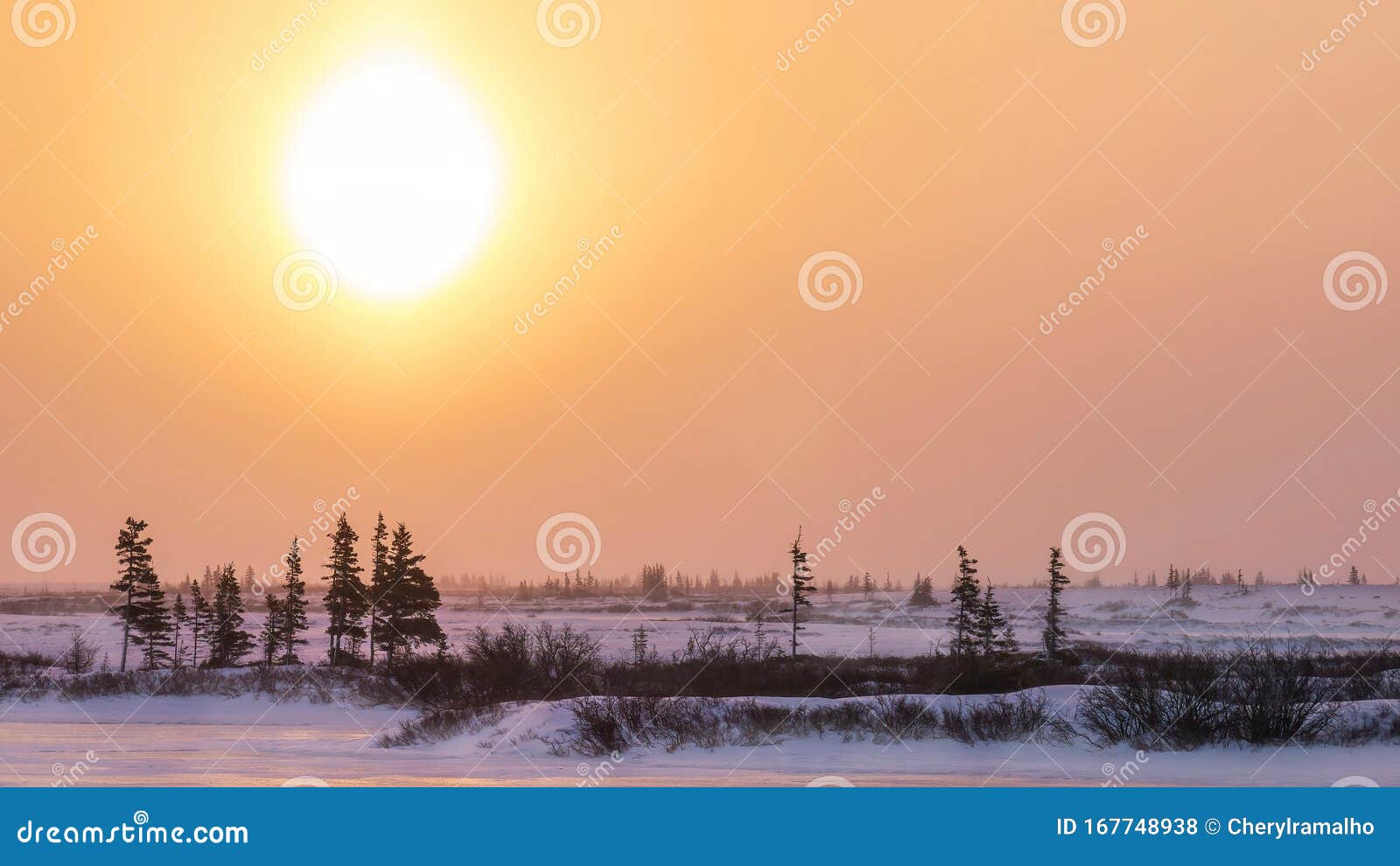 a sun dog sunrise in northern canada in winter.