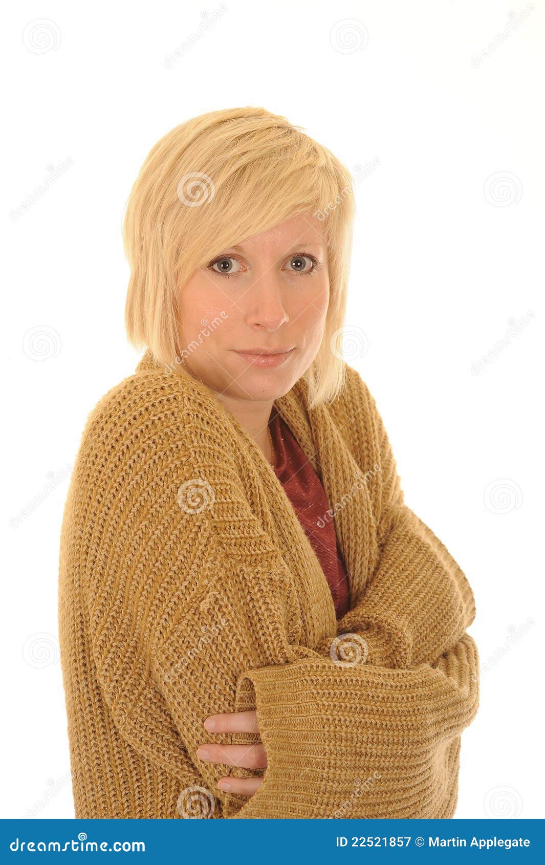 cold young woman in cardigan