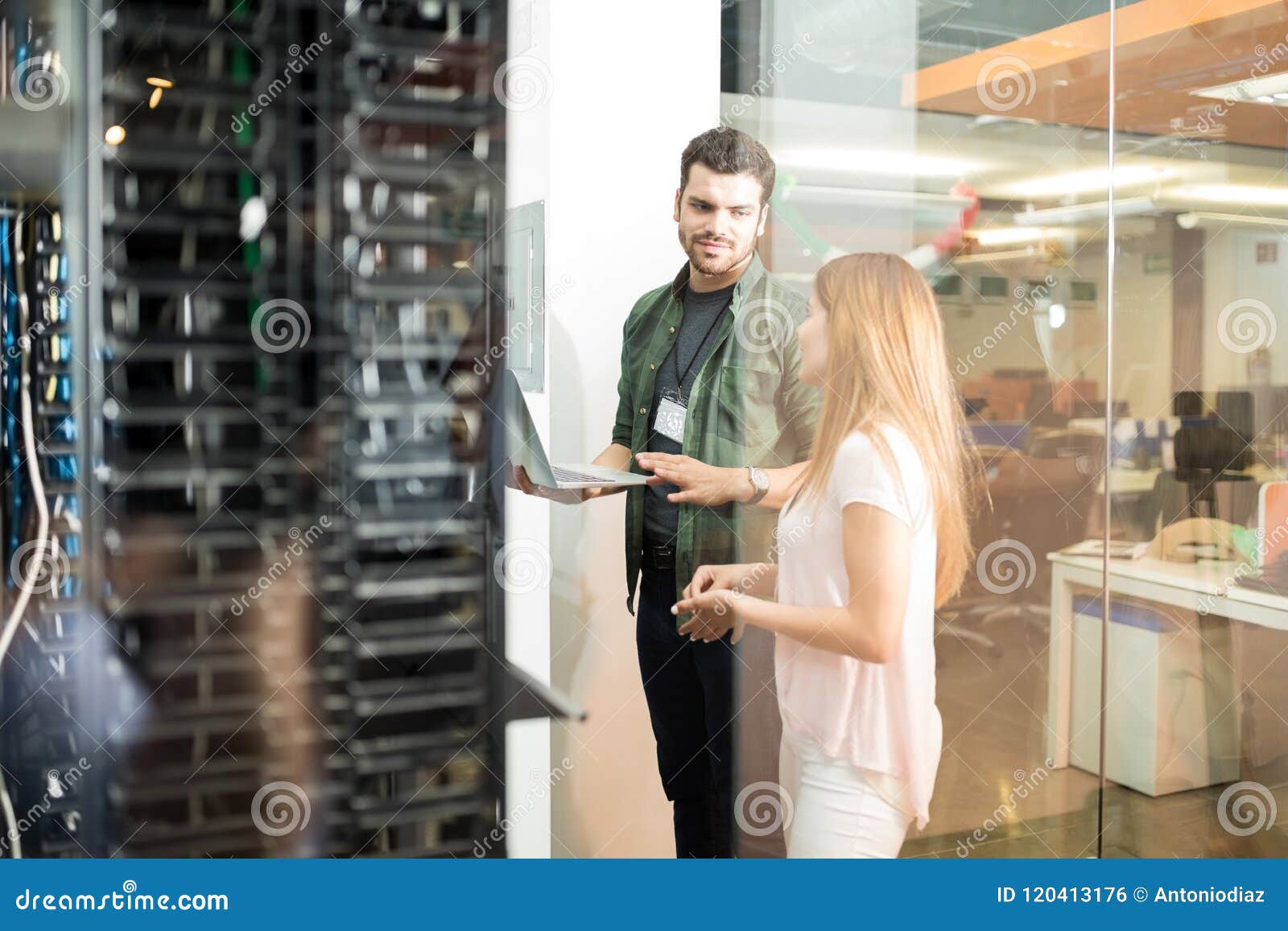 colleagues discussing in office server room