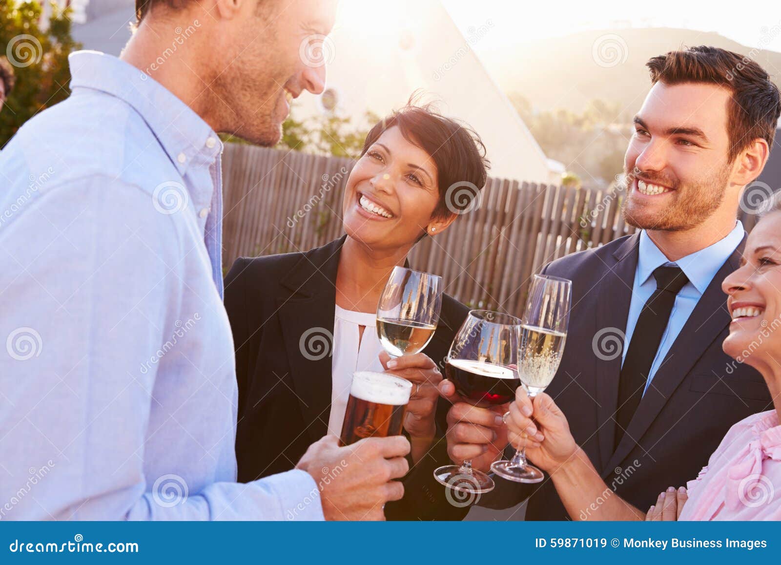 Colleagues Drinking after Work at a Rooftop Bar Stock Image Image of