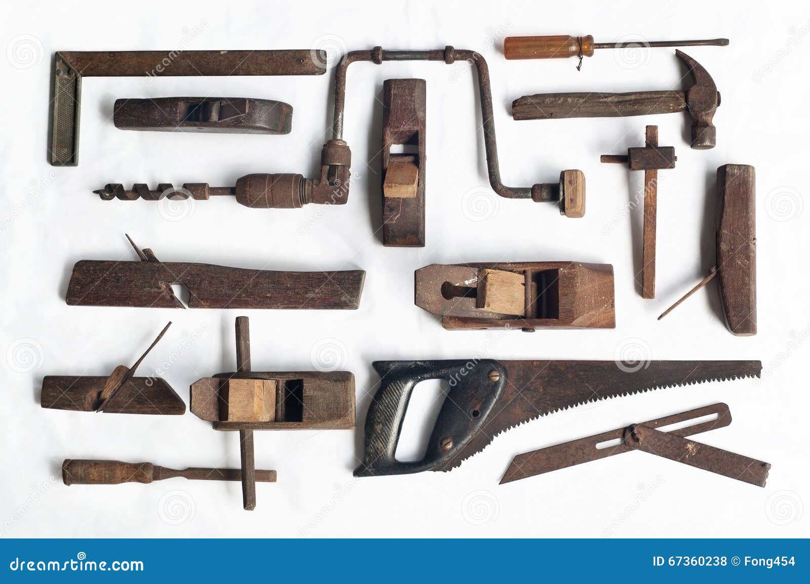 Collection of Antique Woodworking Tools on White Cloth Stock Photo