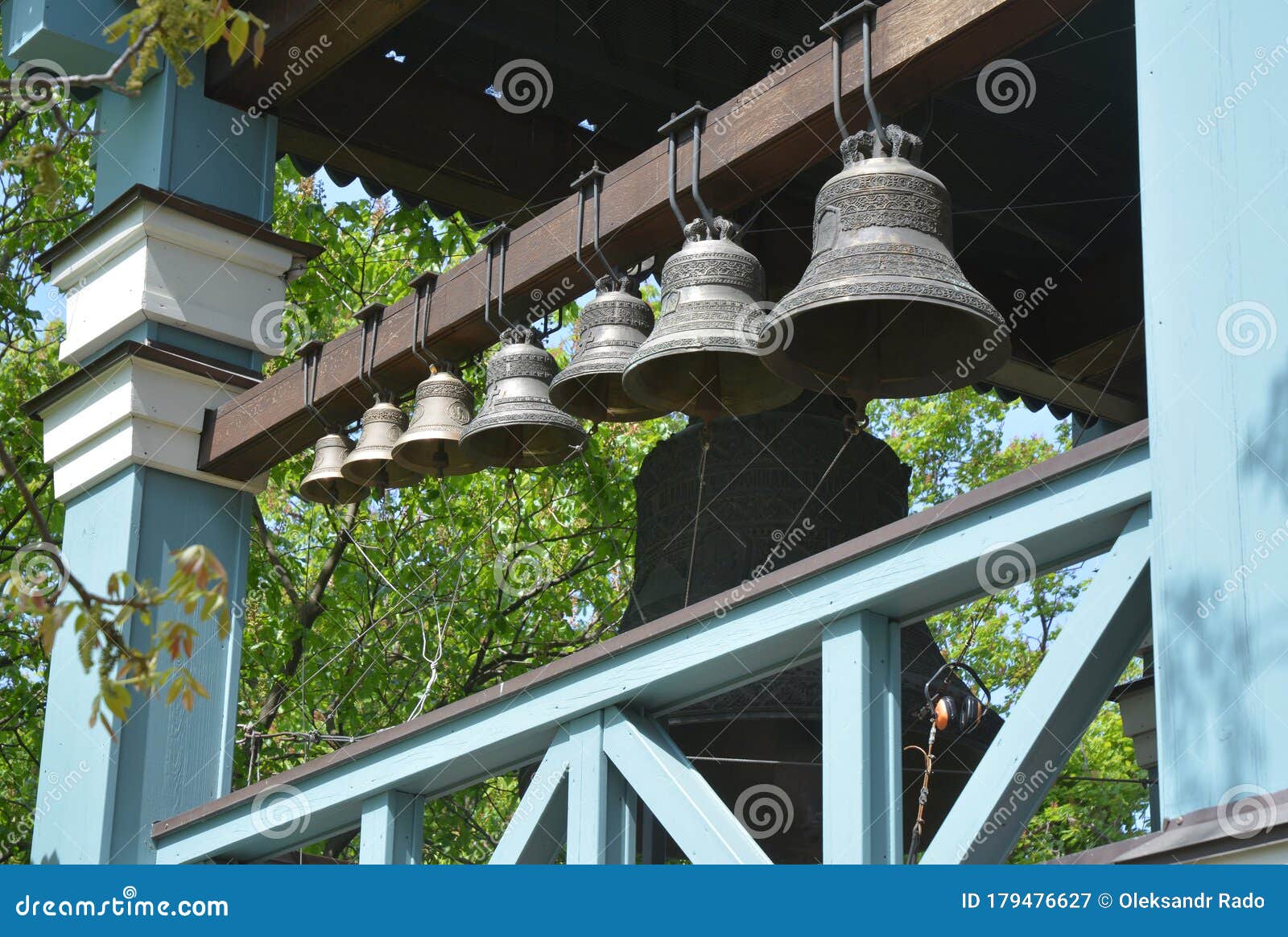 a collection of bronze, cup-d church bells housed in the bell tower of a church which are rung within the liturgy, feasts