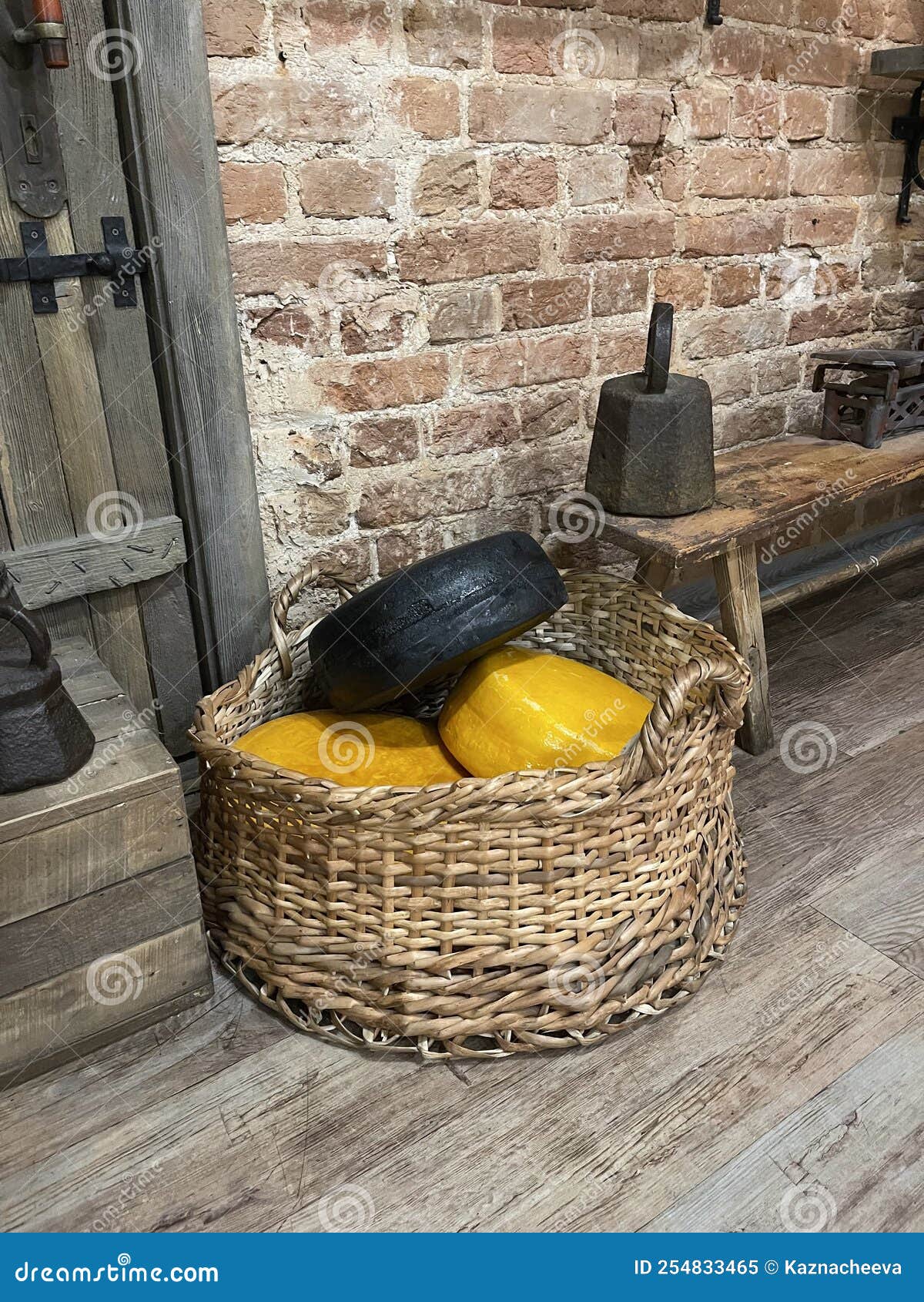 A Collection of Different Types of Cheese in a Basket Stock Image