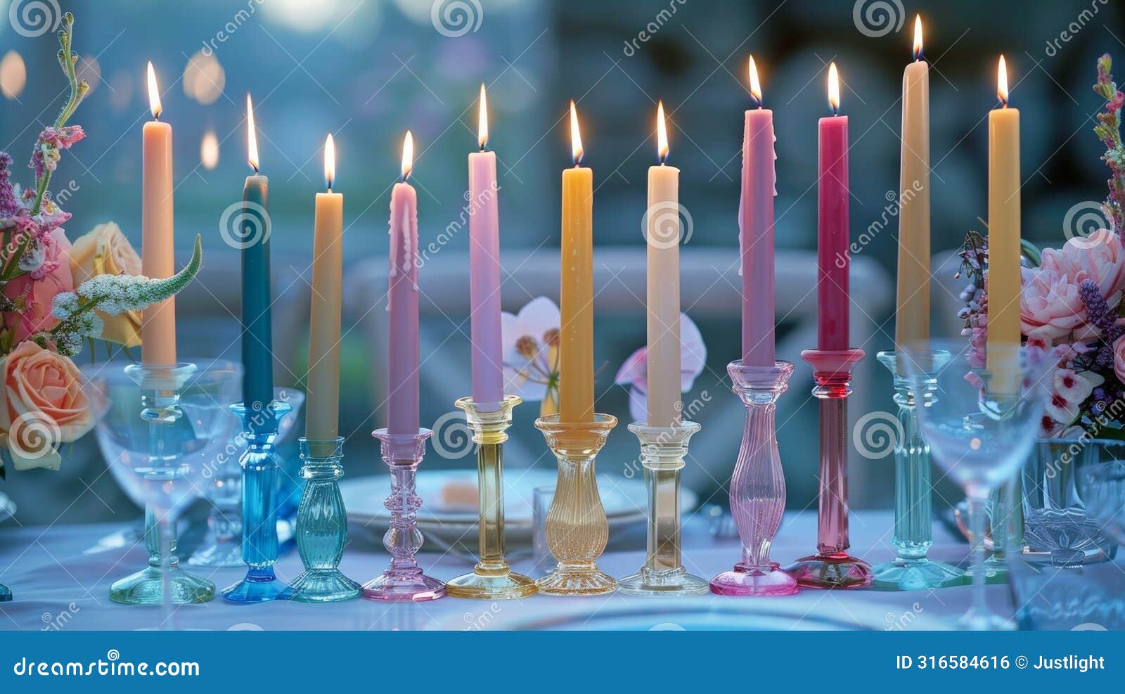 a collection of elegant taper candles in various jewel tones casting a romantic aura over a dinner table
