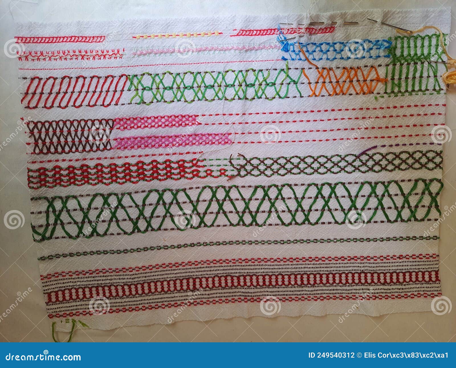 Collection of Embroidery Stitch Patterns on a Fabric, Stock Photo