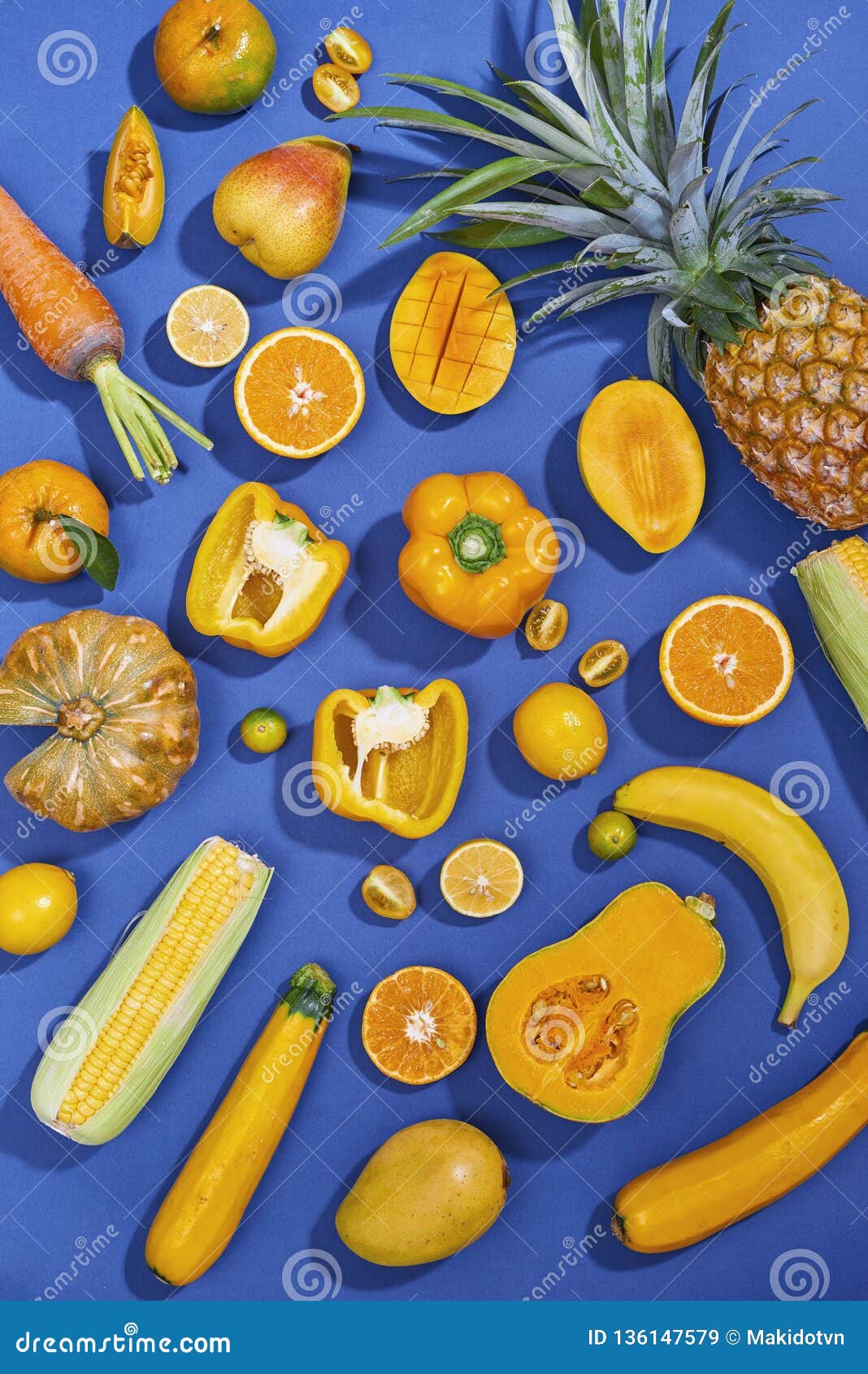 Collection Of Fresh Yellow Fruit And Vegetables On The Blue Background ...