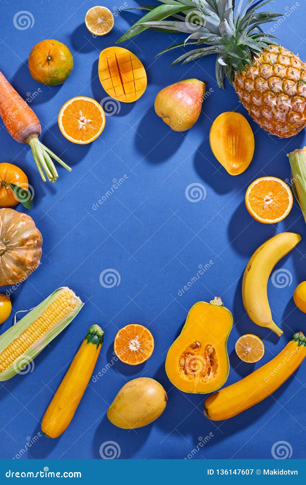 Collection Of Fresh Yellow Fruit And Vegetables On The Blue Background ...