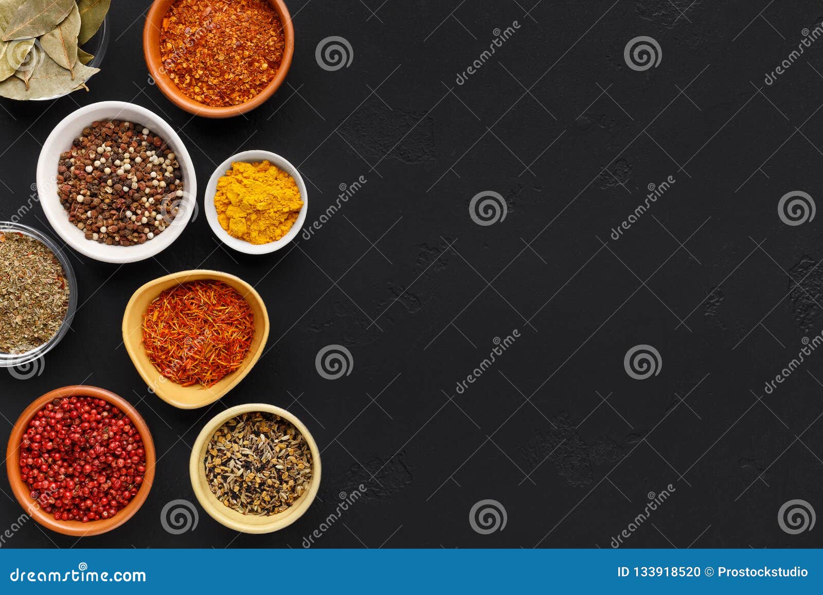 Collection of Indian Spices in Bowls on Background Stock Photo Image