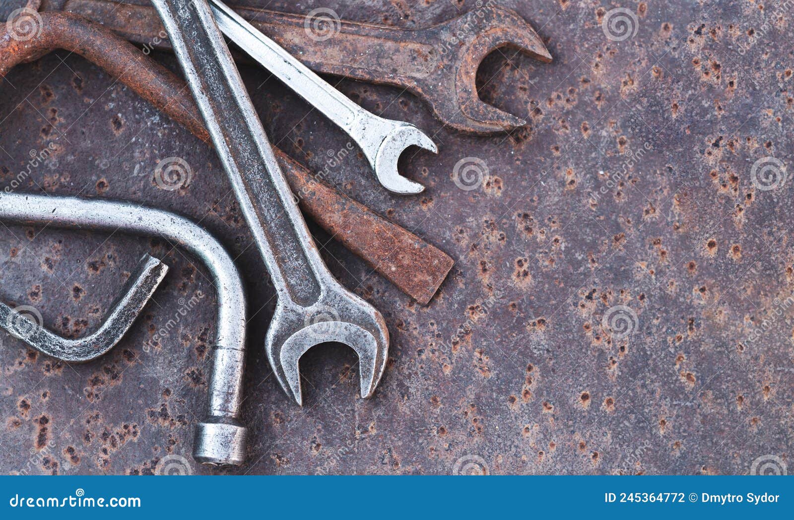 Old Wrench Spanner and Garage Tools on Rusty Background Stock Photo