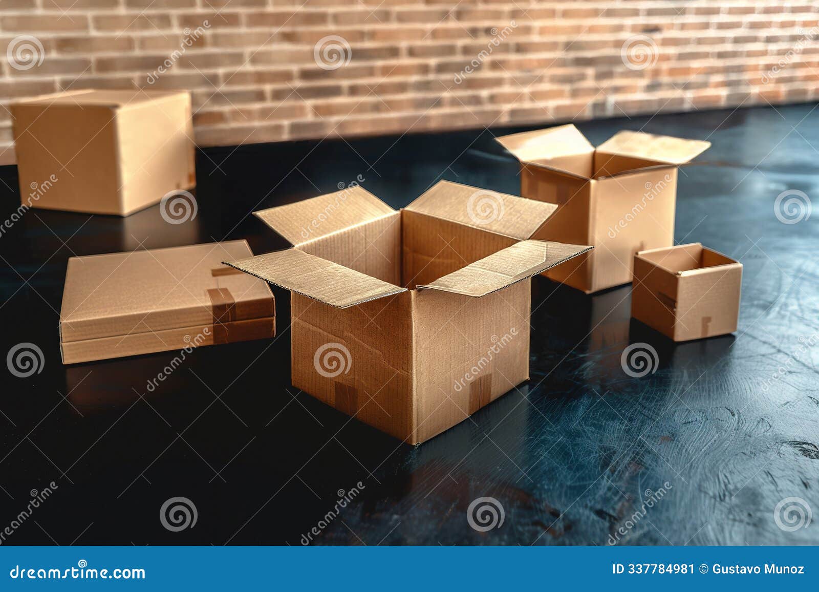 open and closed brown cardboard boxes on a dark reflective surface, with a brick wall in the background. shipping, packaging