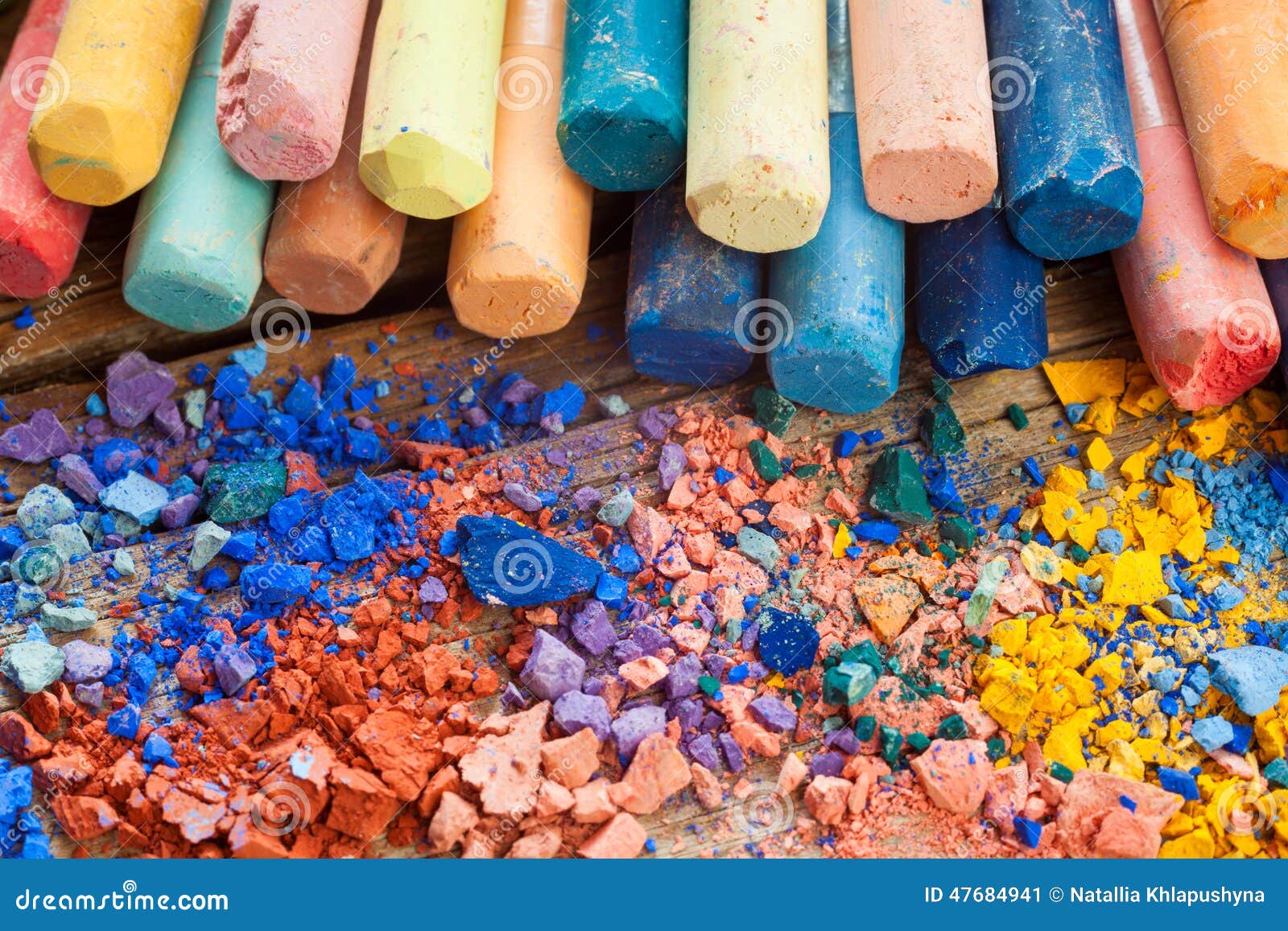 Collection of Rainbow Colored Pastel Crayons with Crushed Chalk Stock