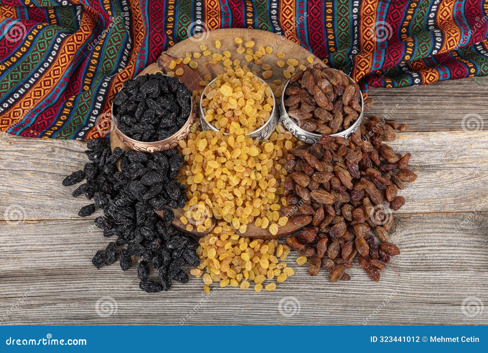 collection of raisins that offers a vibrant and nutritious array. three different types of raisins are arranged in rows. texture