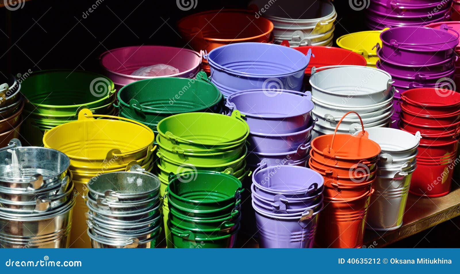 collection of the varicolored metal buckets