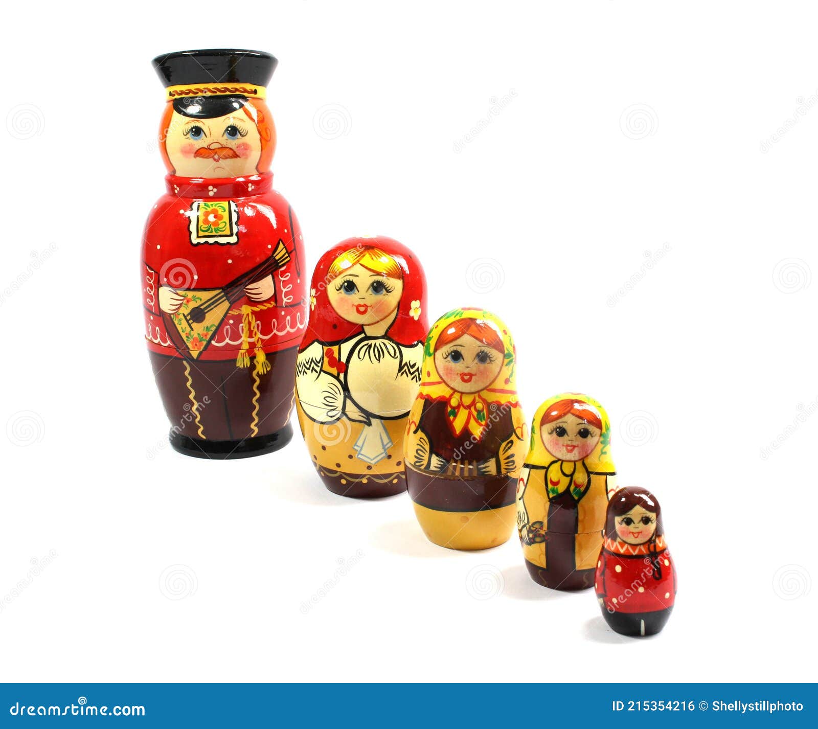 Collection of Wooden Nesting Stacking Dolls on White Background Stock