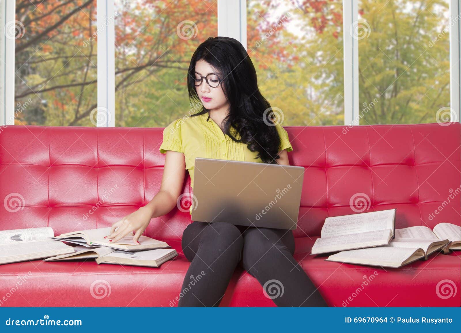 College Student with Laptop Reads Books on Sofa Stock Photo Image of