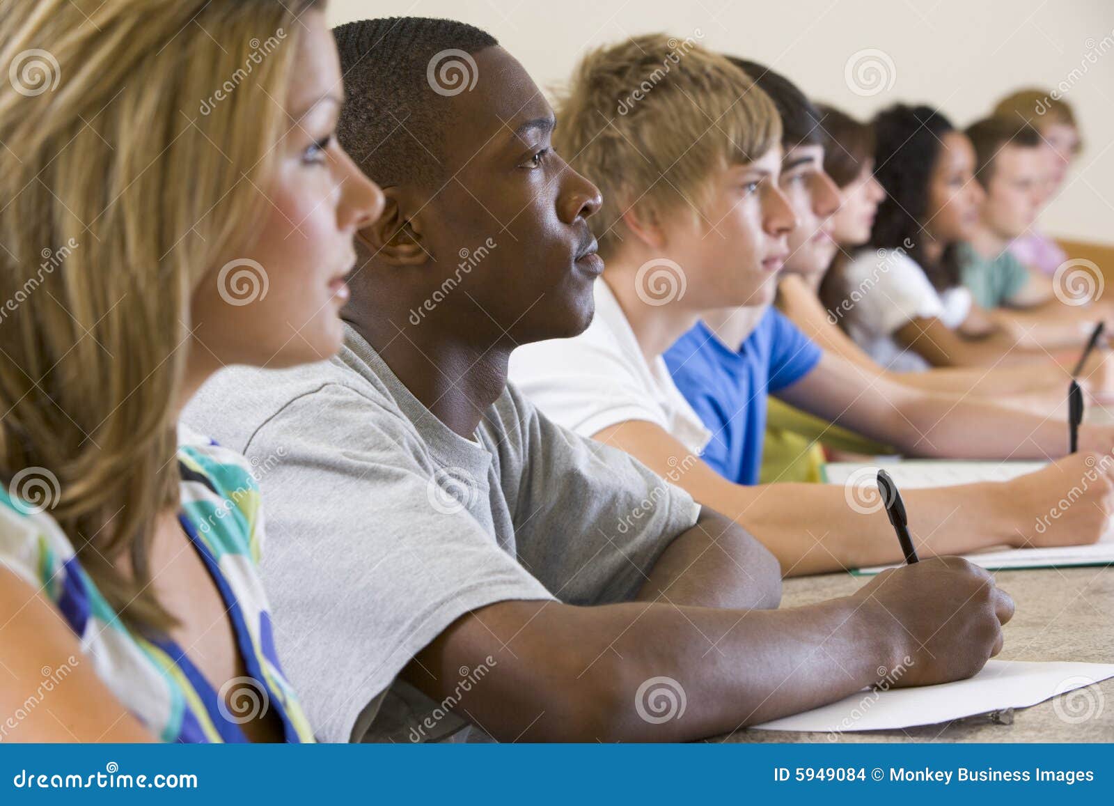 college students listening to a university lecture