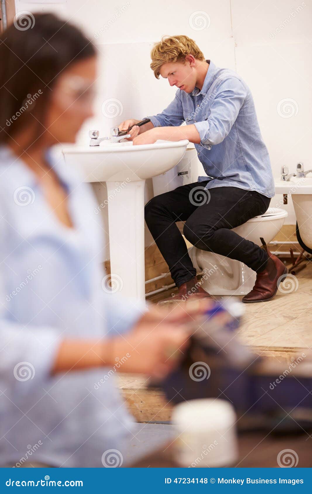 College Students Studying Plumbing Working on Washbasin Stock Photo Image of teenager, craft