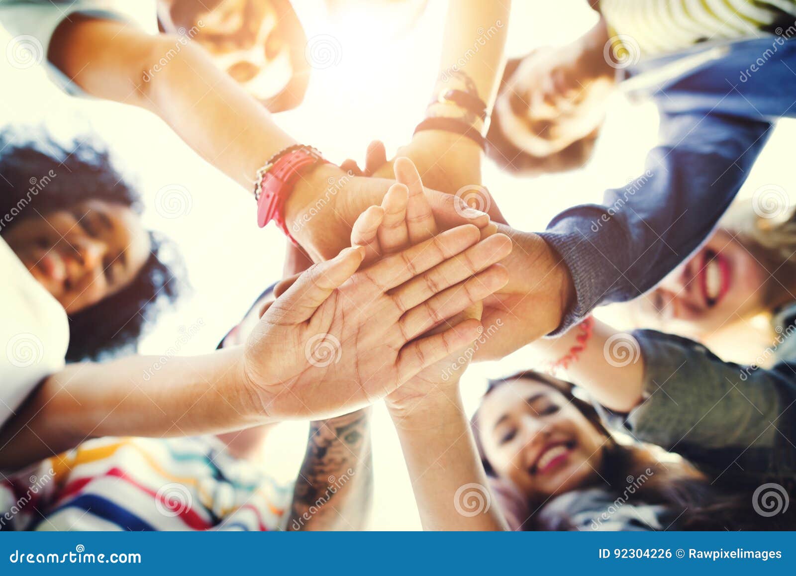 college students teamwork stacking hand concept