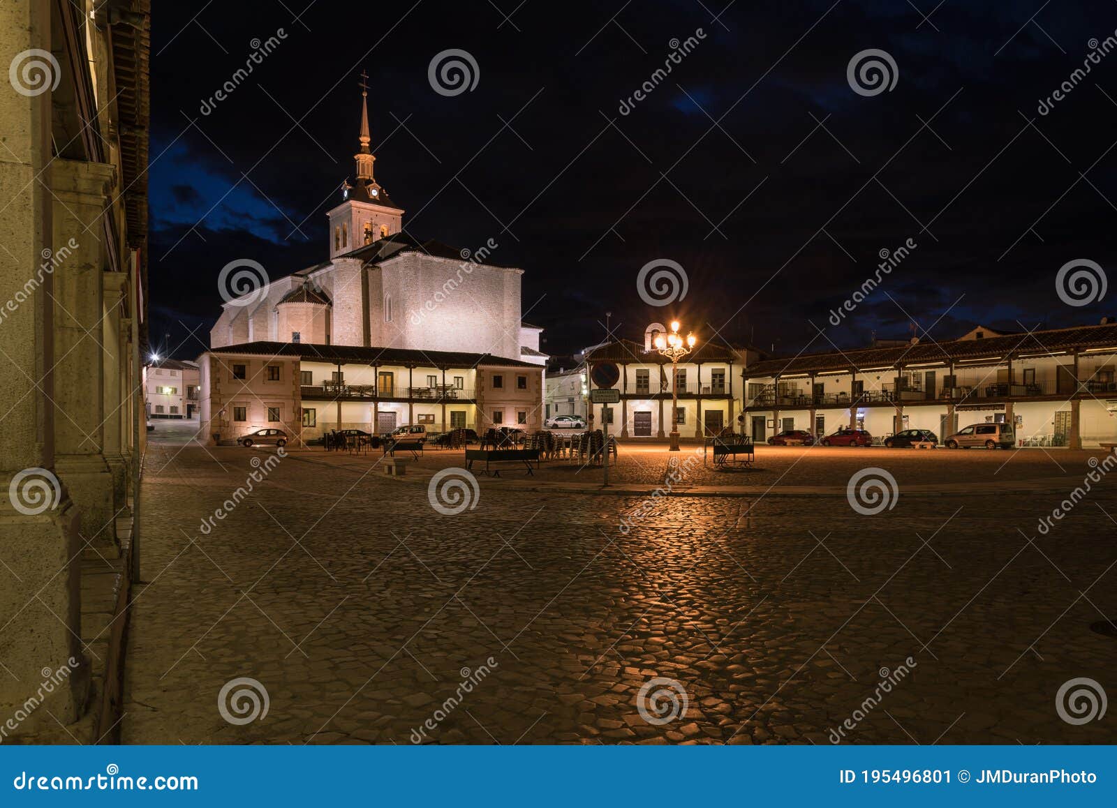 colmenar de oreja city landscape with the arcaded square illuminated at night, spain