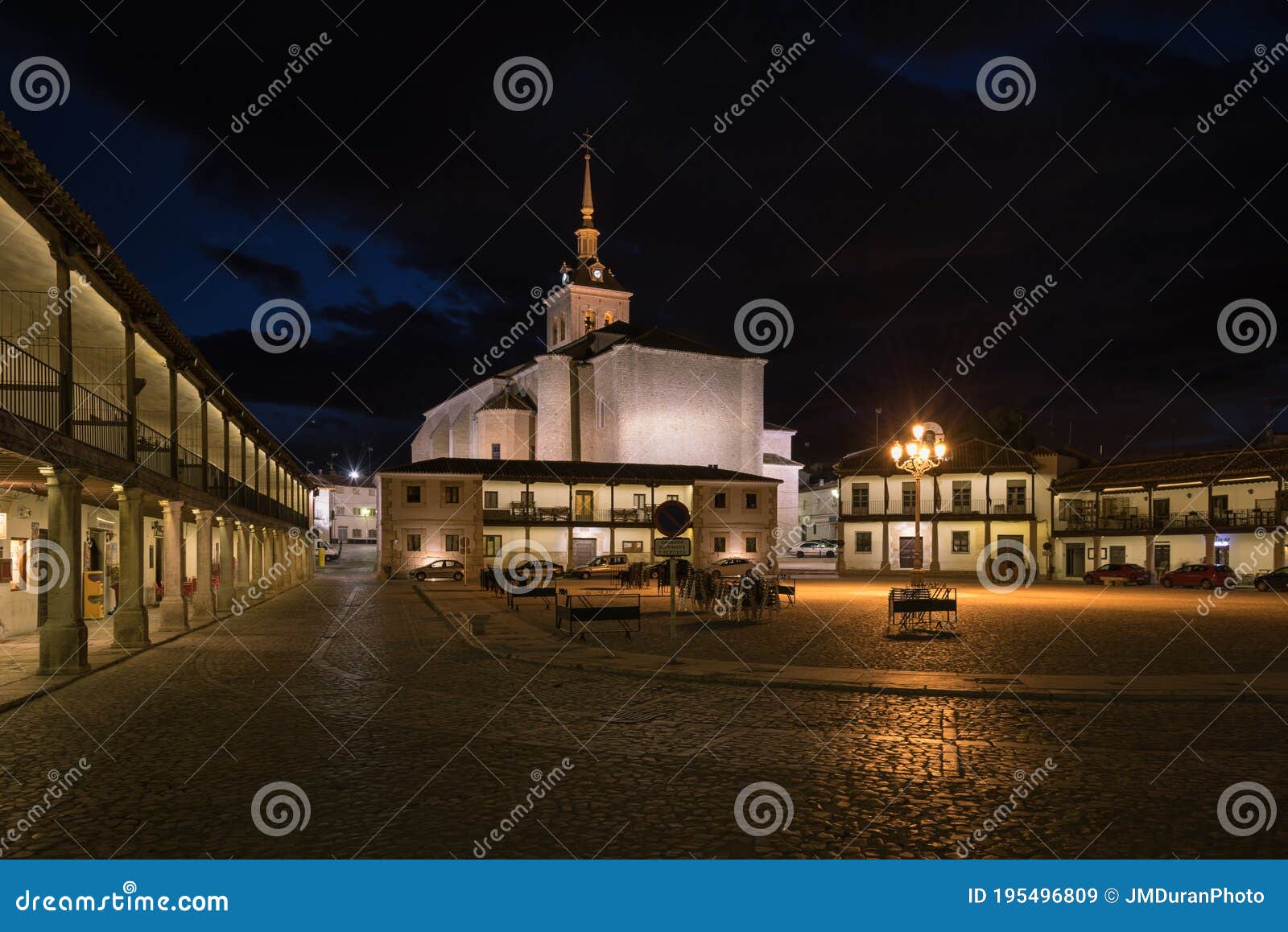 colmenar de oreja city landscape with the arcaded square illuminated at night, spain