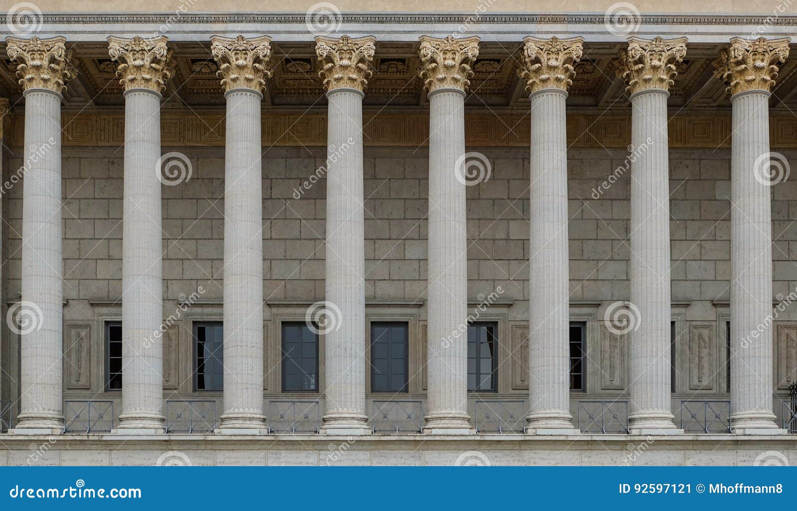 a colonnade of a public law court. a neoclassical building with a row of corinthian columns.