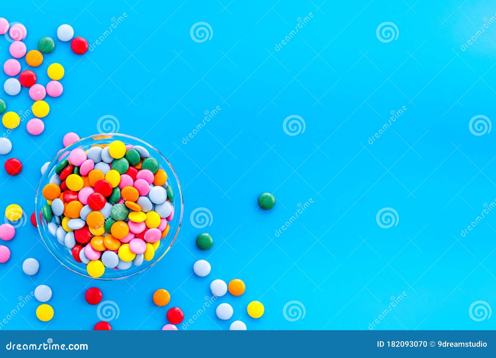 Color Candy on Blue Background Top View Copy Space Stock Photo Image