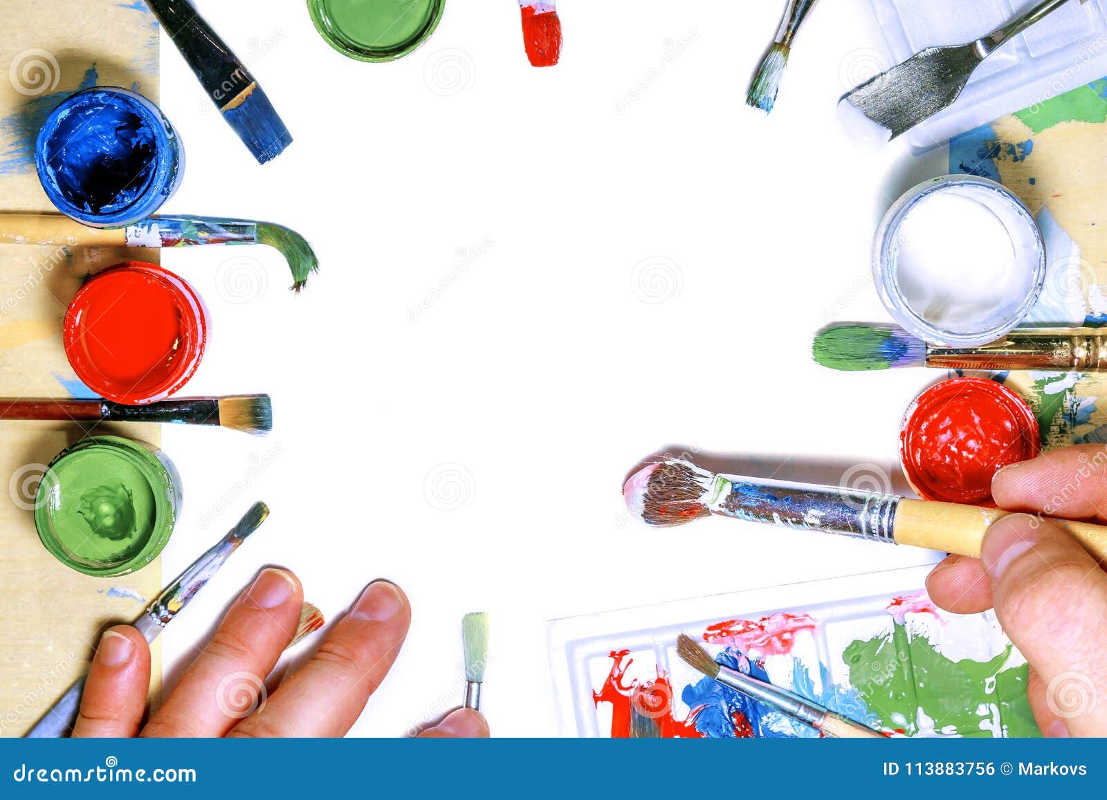color gouache jars on white background. top view, copy space