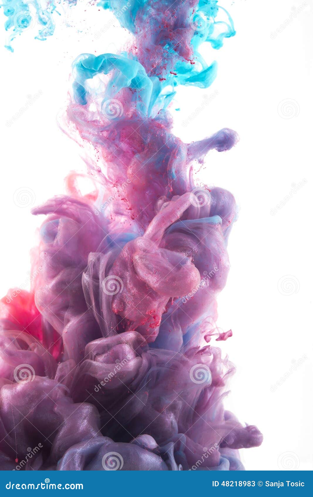 color ink drop in water. redish violet, deep blue, glitter, cyan