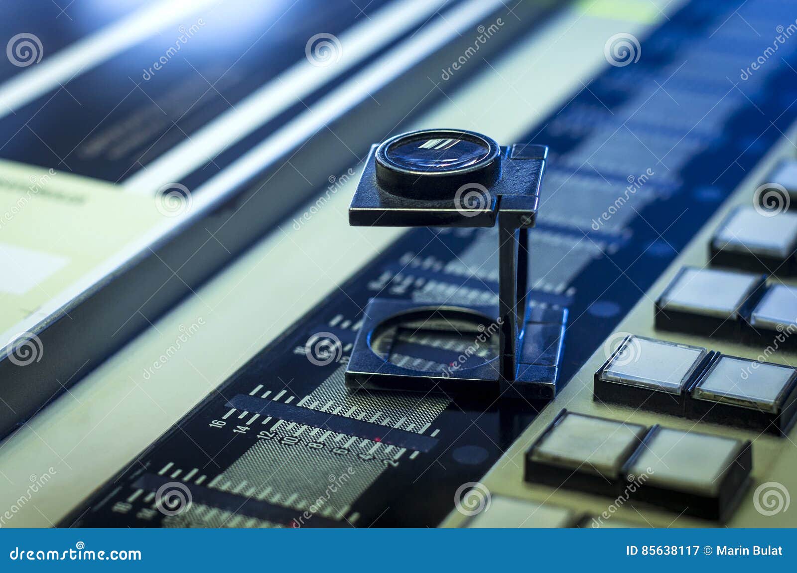 Color Management in Printing Process with Magnifying Glass Stock Image
