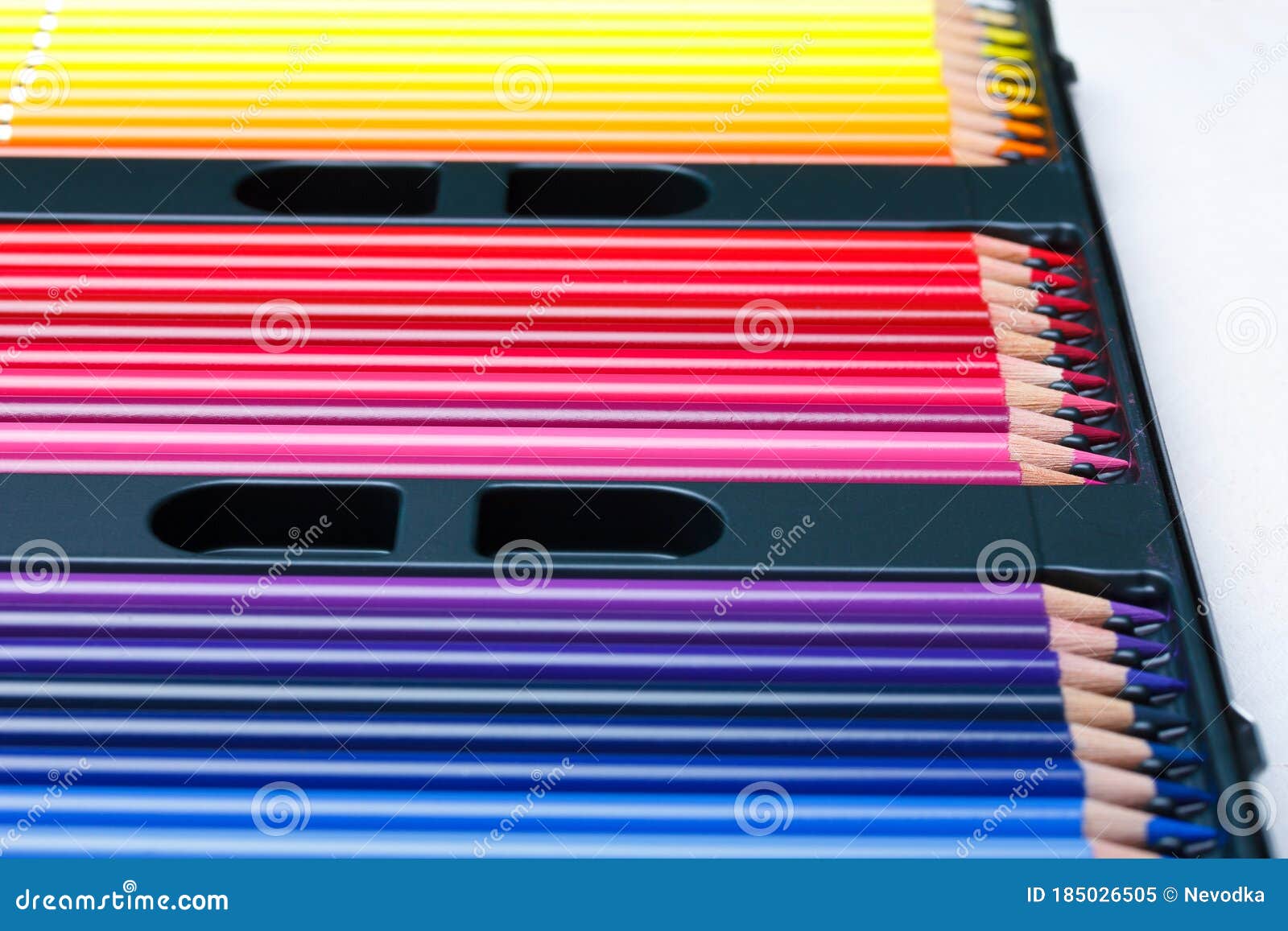 Color pencils in box stock image. Image of blue, black 185026505