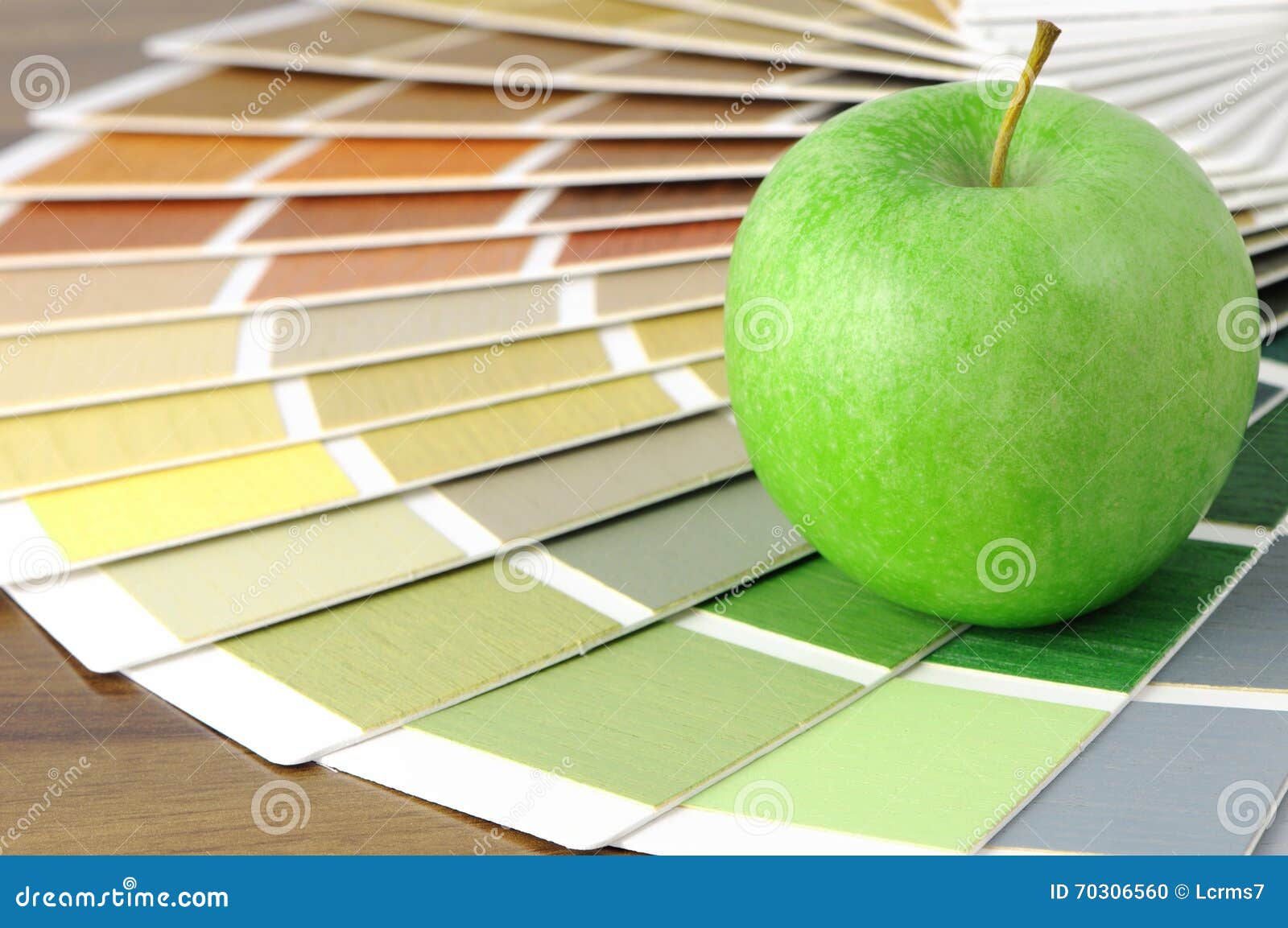 color swatch on a table with green apple