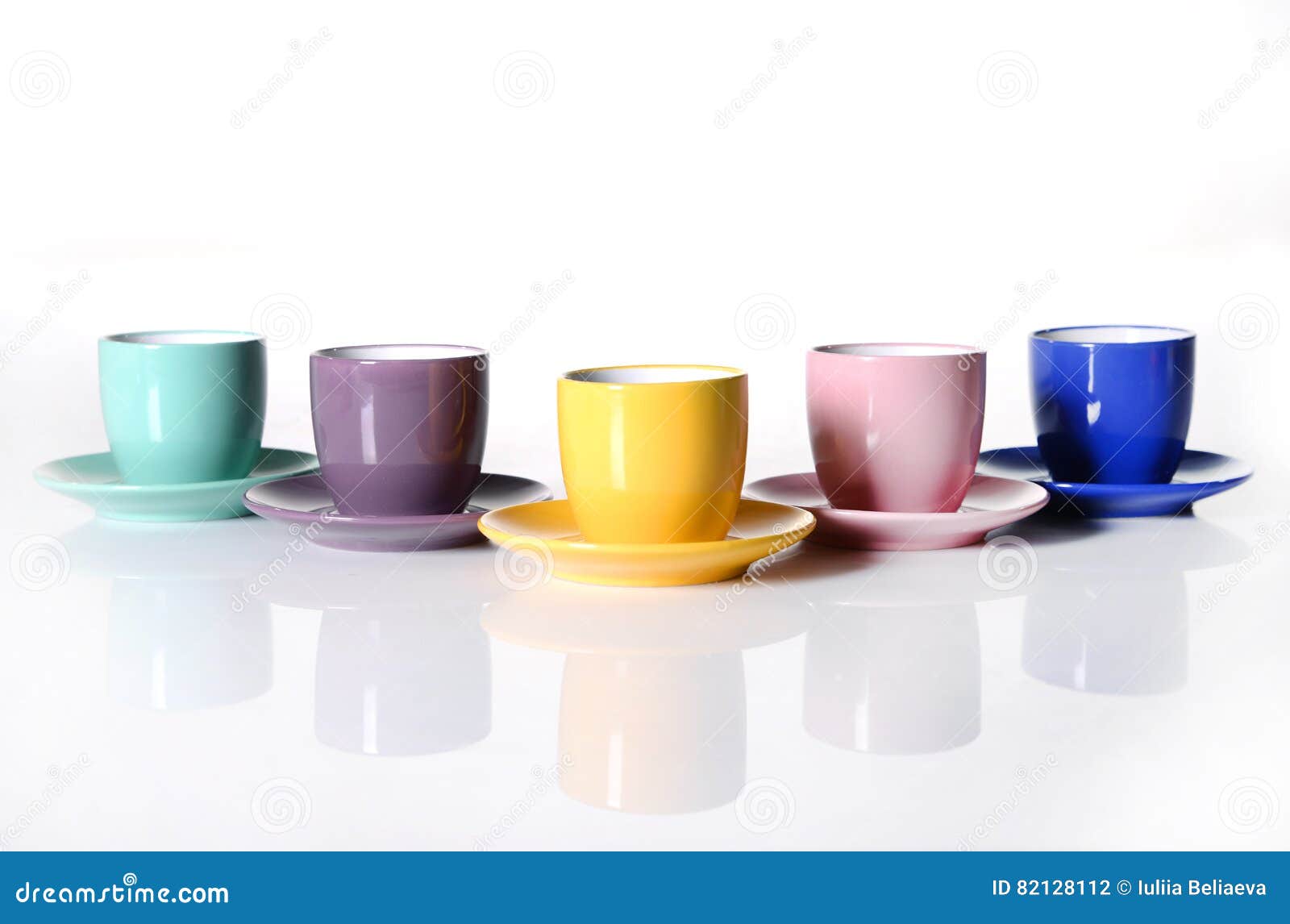 Colored cups and saucers stock photo. Image of color 82128112