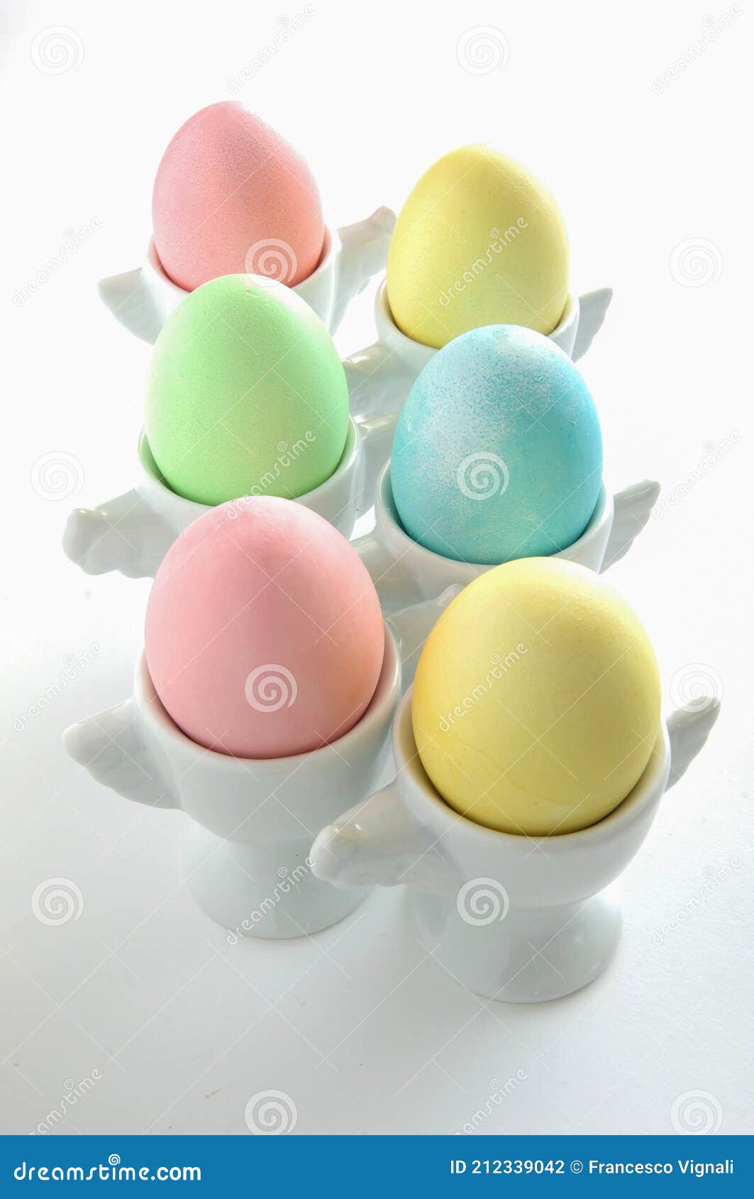 Colored and Decorated Eggs for Easter Breakfast in Italy on White