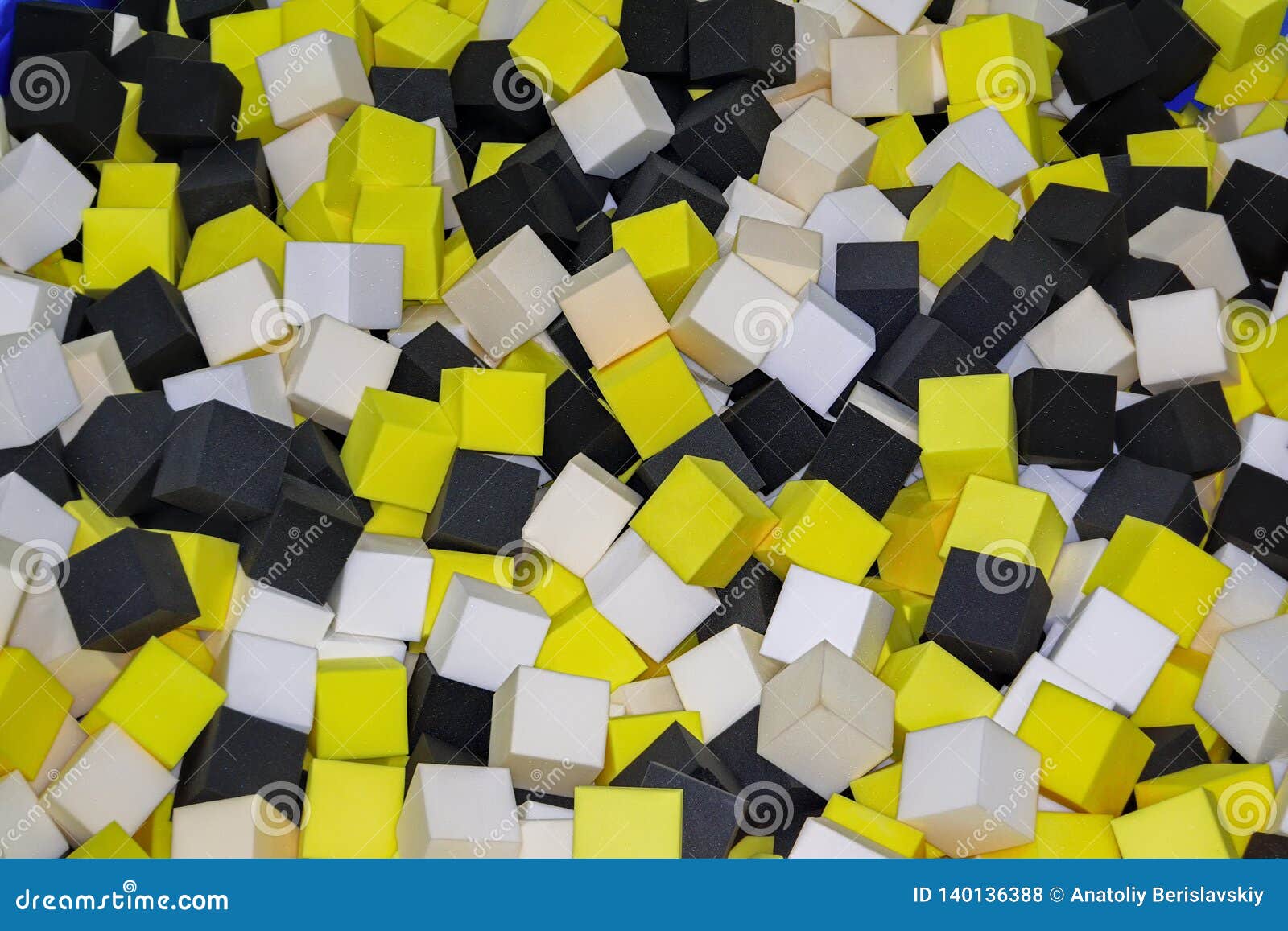 Colored Foam Rubber Cubes in the Trampoline Pit Closeup Background