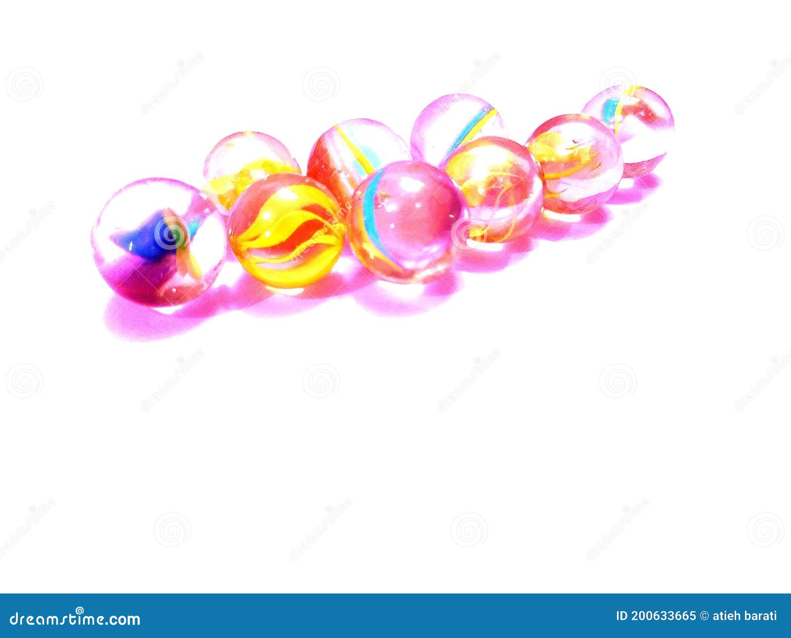 Colored glass marbles stock image. Image of pink, lighting 200633665