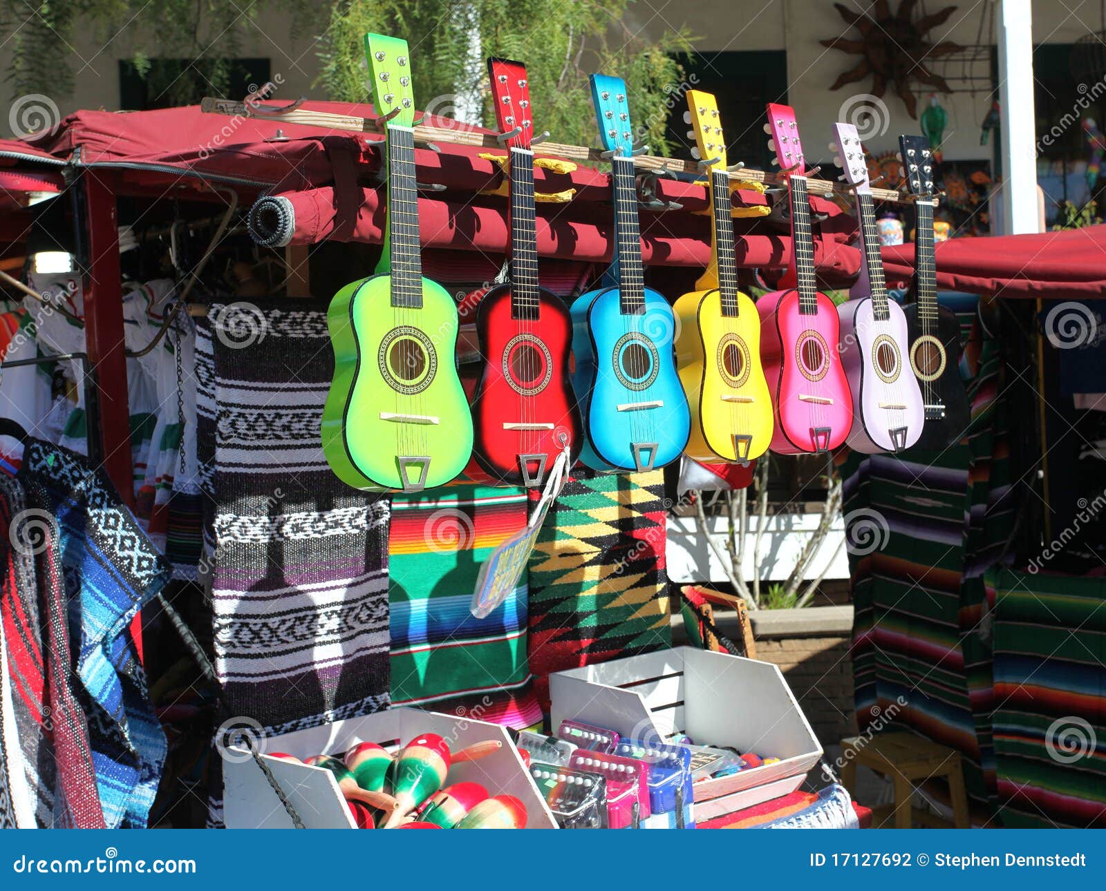 Brightly colored guitars on sale in a Mexican open market