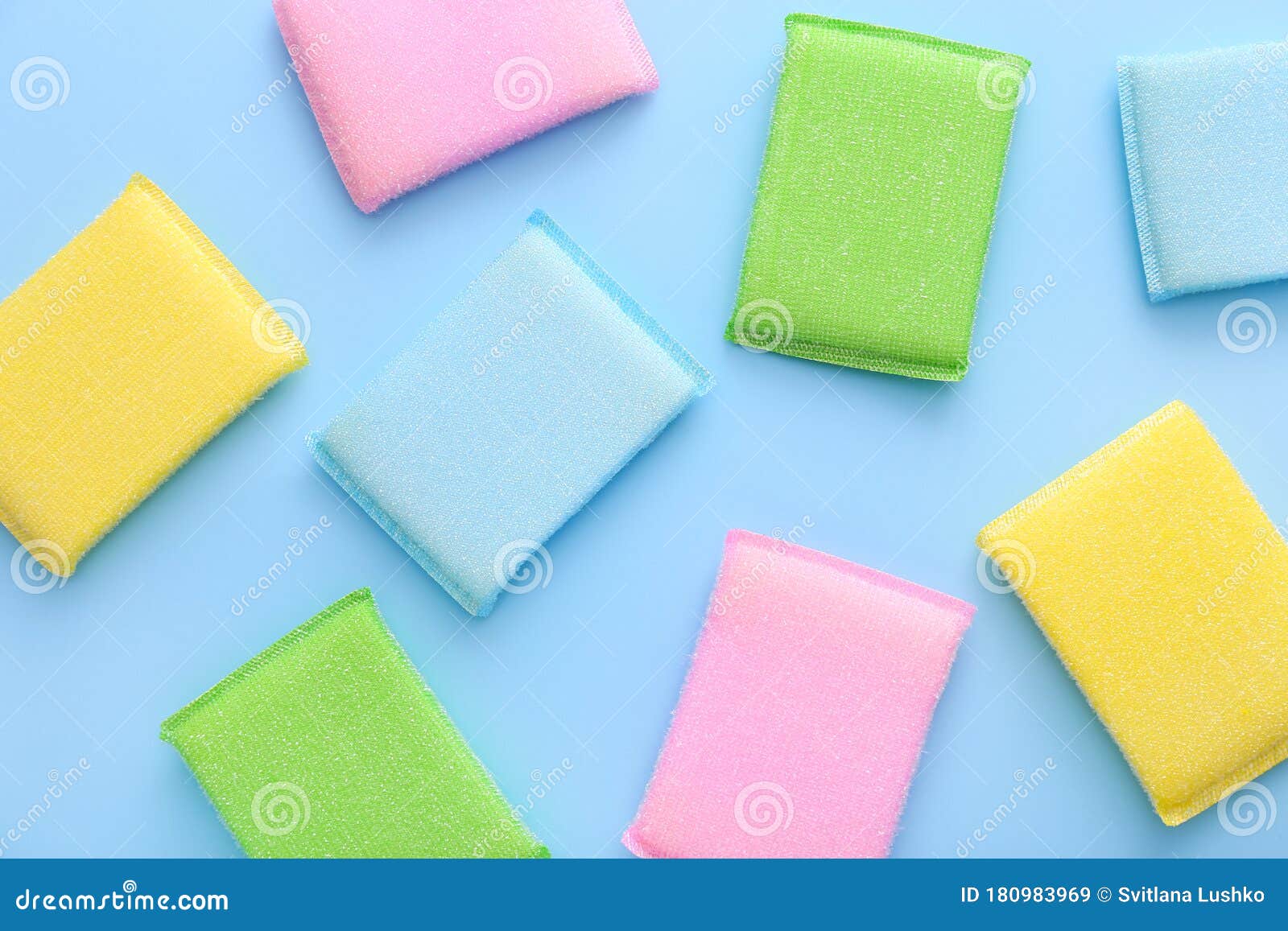 Colored Kitchen Sponges on Blue Background. Kitchen Cleaning Set Stock
