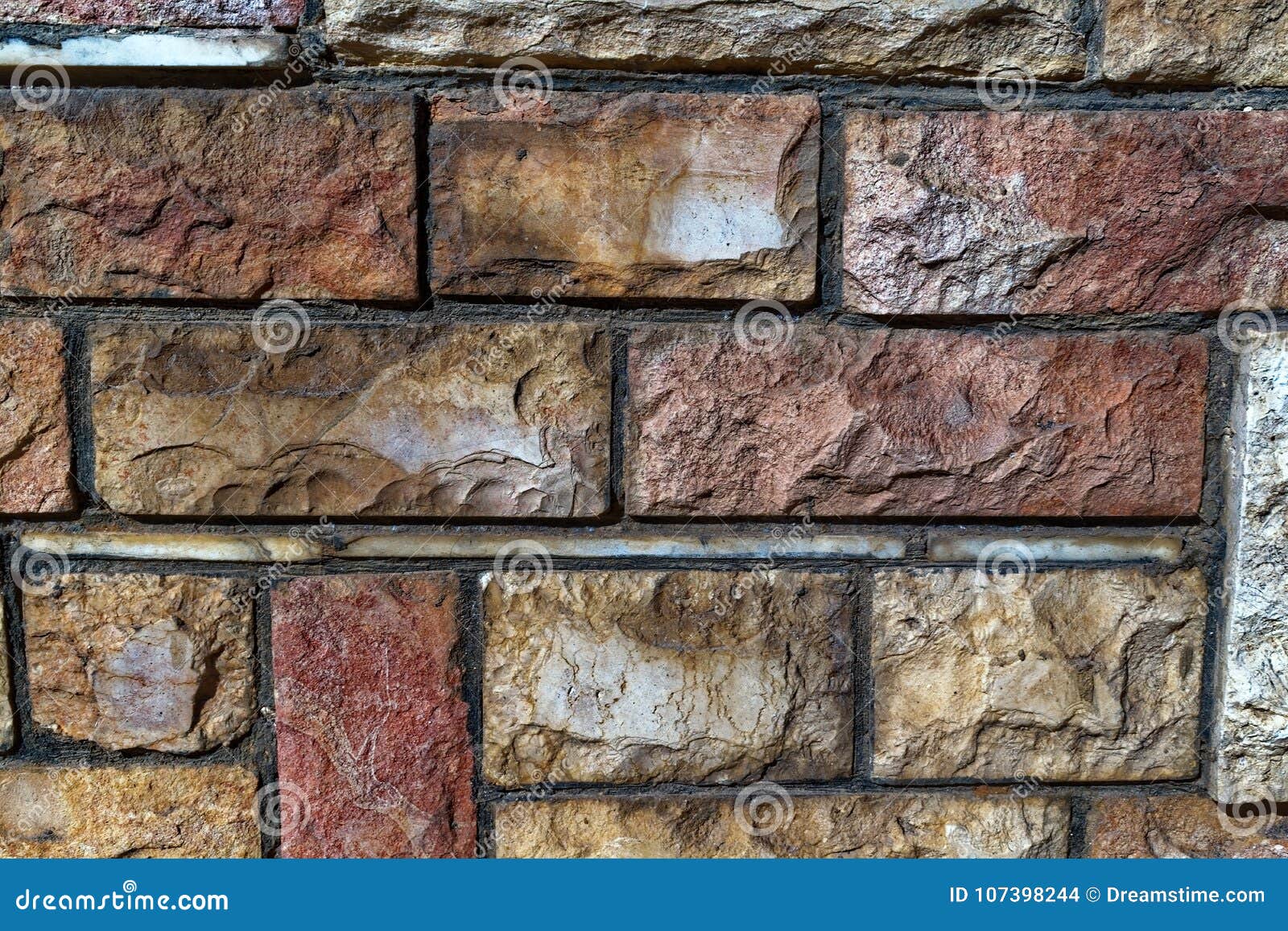 colored old bricks of varying size texture photo close up