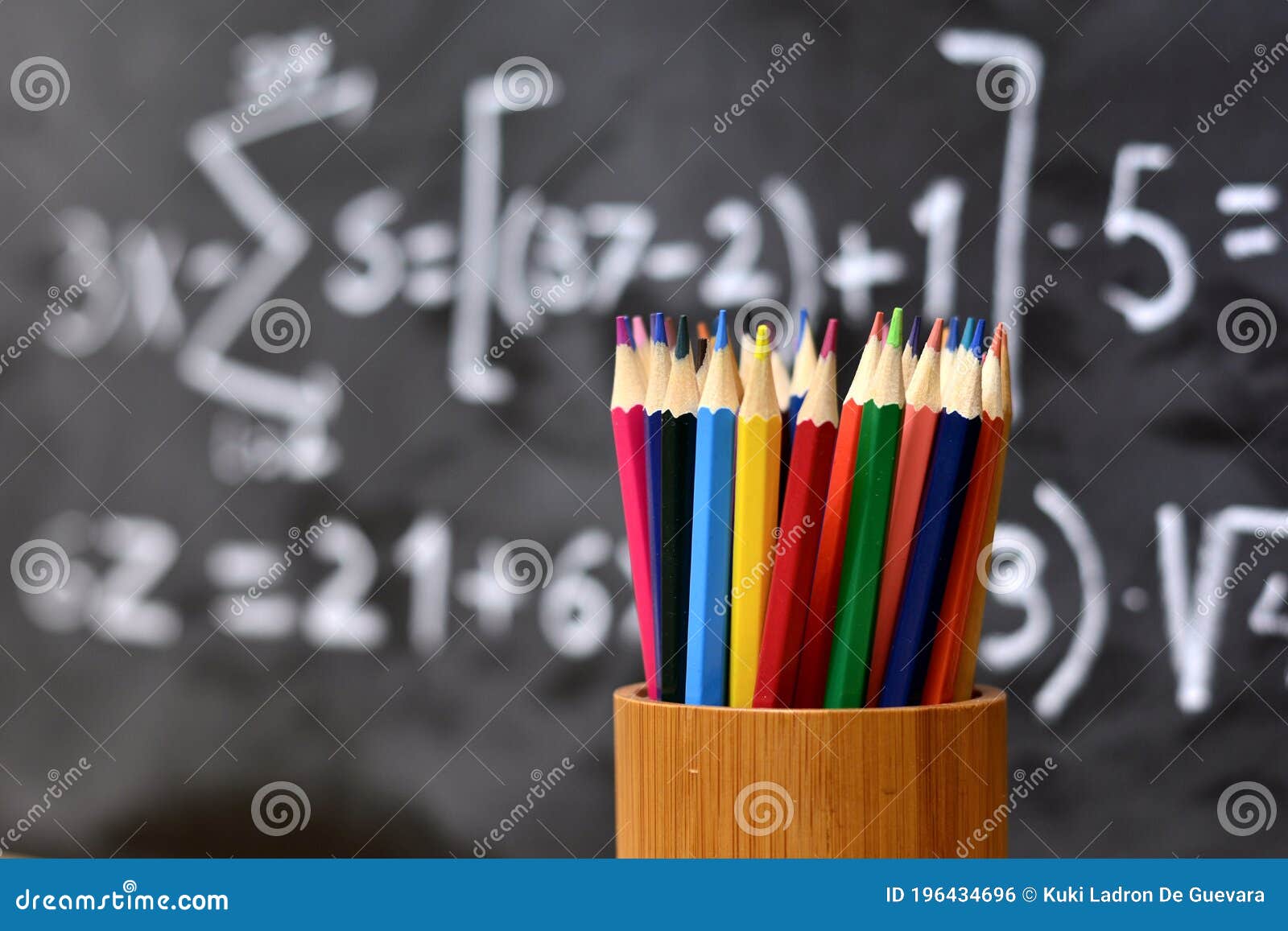 colored pencils with blackboard background