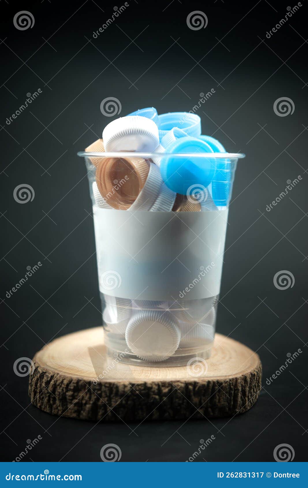 Colored Plastic Bottle Caps are Recycled in a Plastic Glass. Recycle Concept Stock Image Image