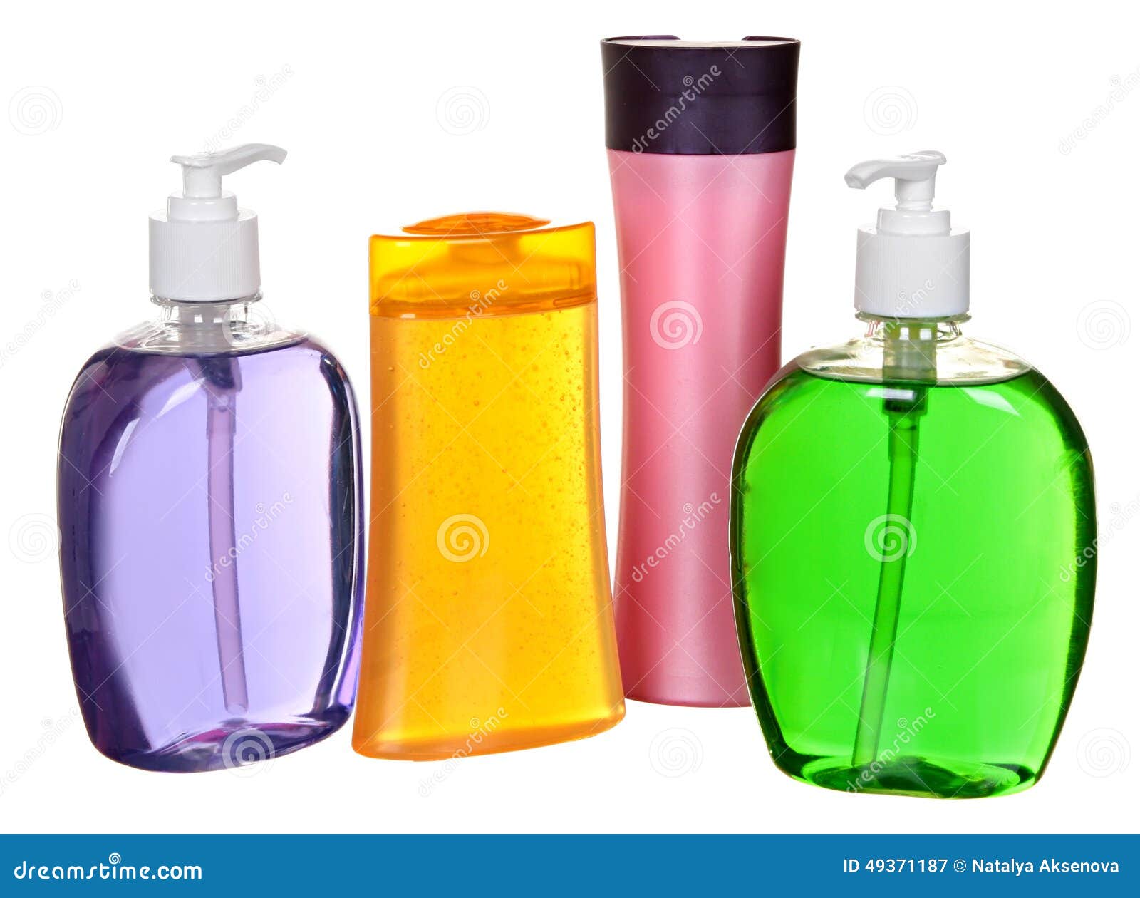 colored plastic bottles with liquid soap and