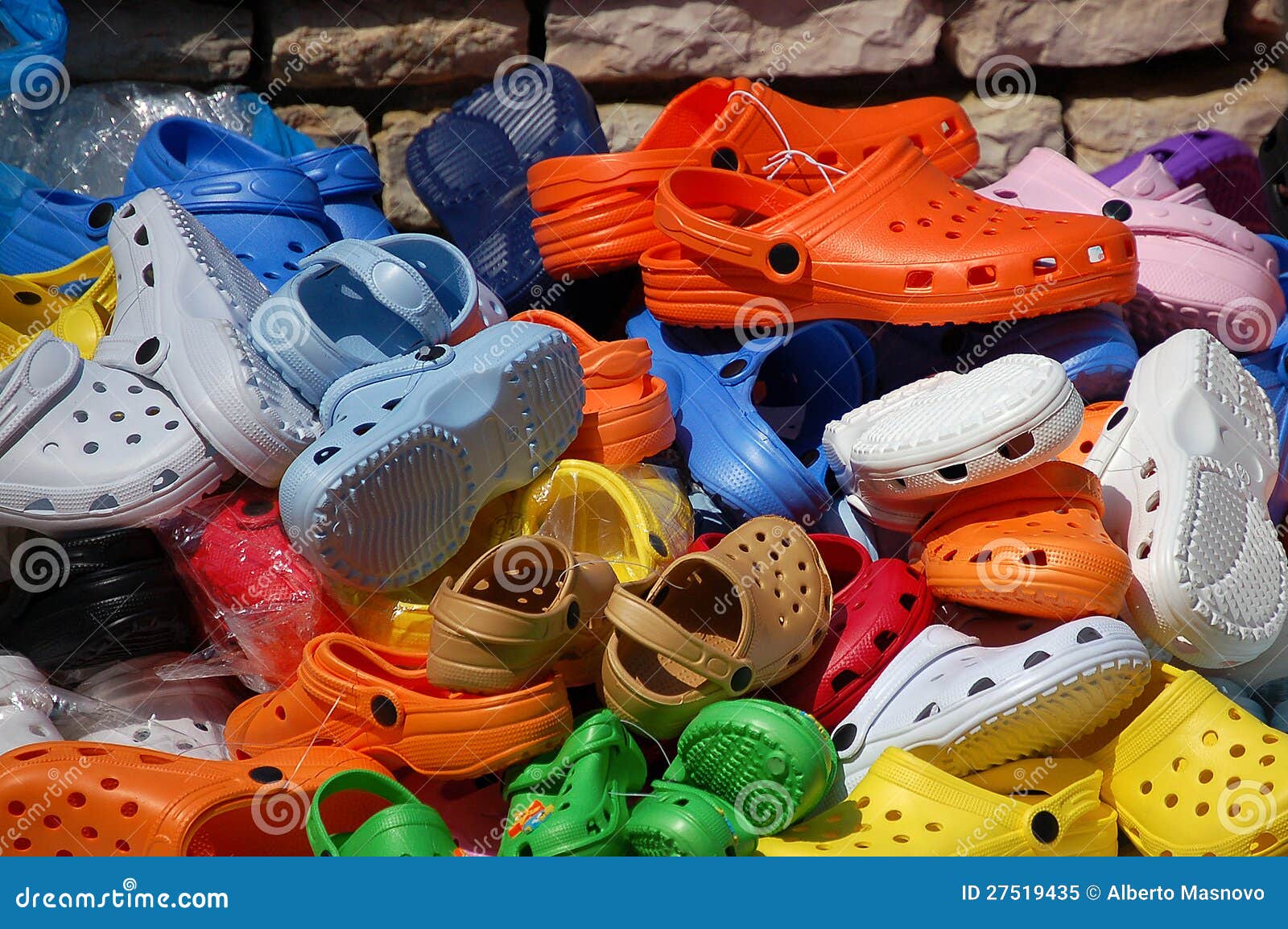 Colored Plastic Clogs stock image. Image of kids, brown - 27519435