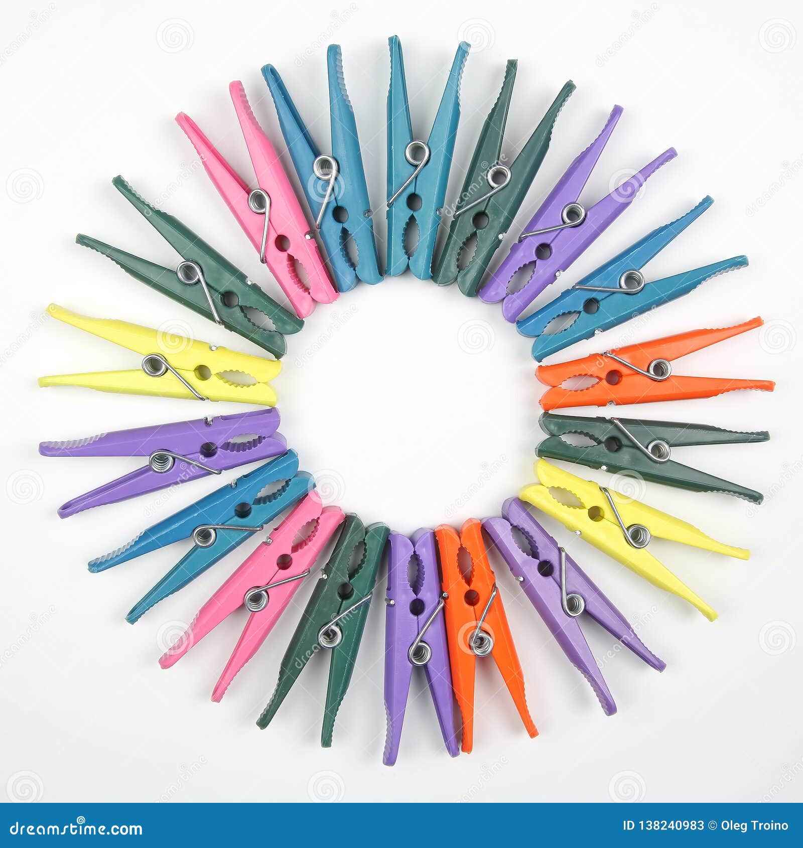 Colored Plastic Clothespins For Clothes On A White Background Stock