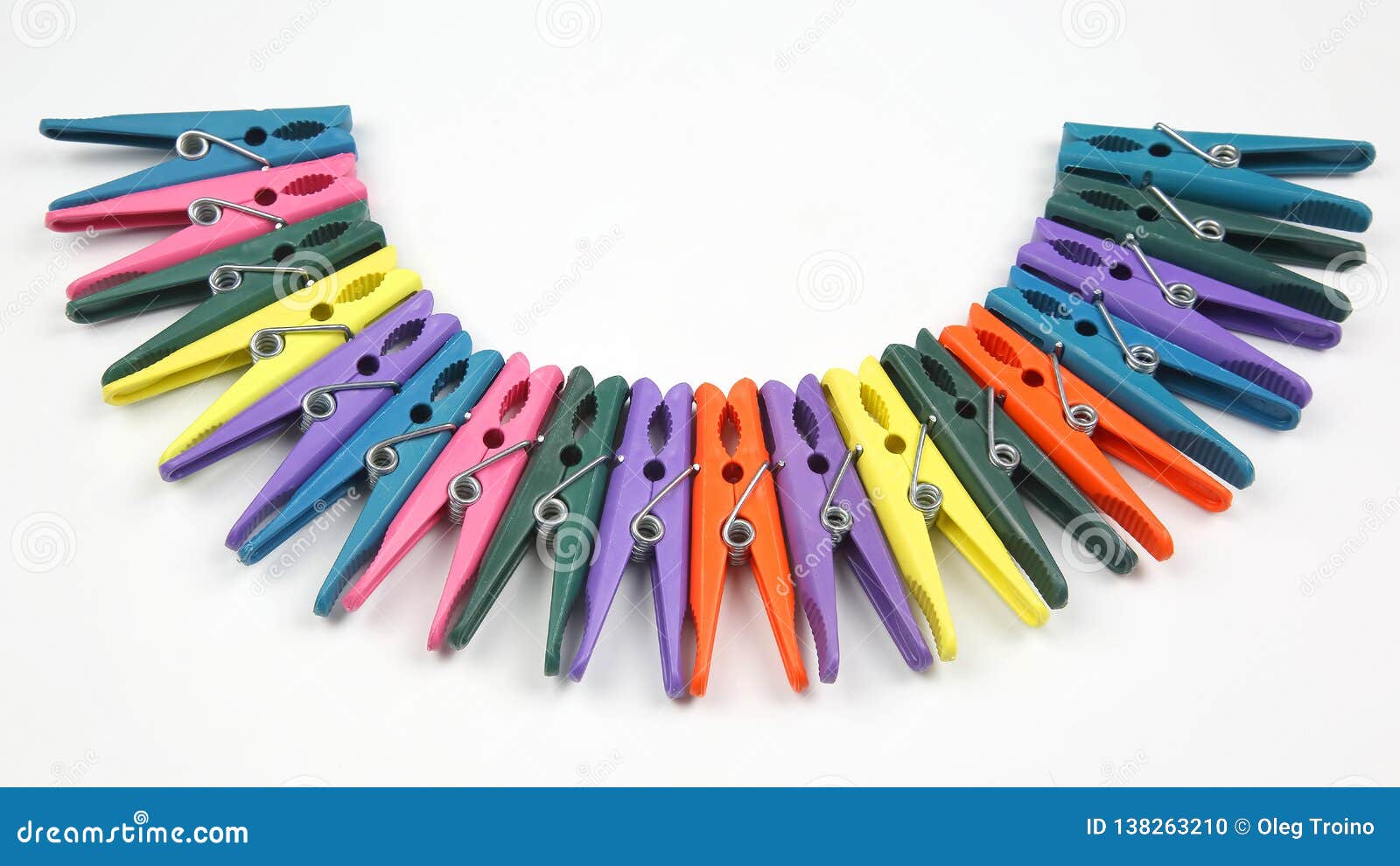 Colored Plastic Clothespins For Clothes On A White Background Stock
