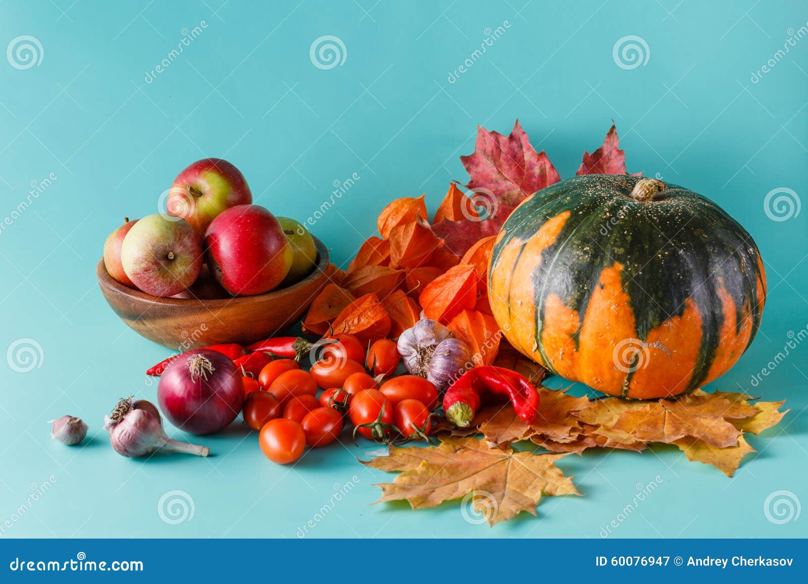 colored pumpkin and fapples on aquamarine shadowless background