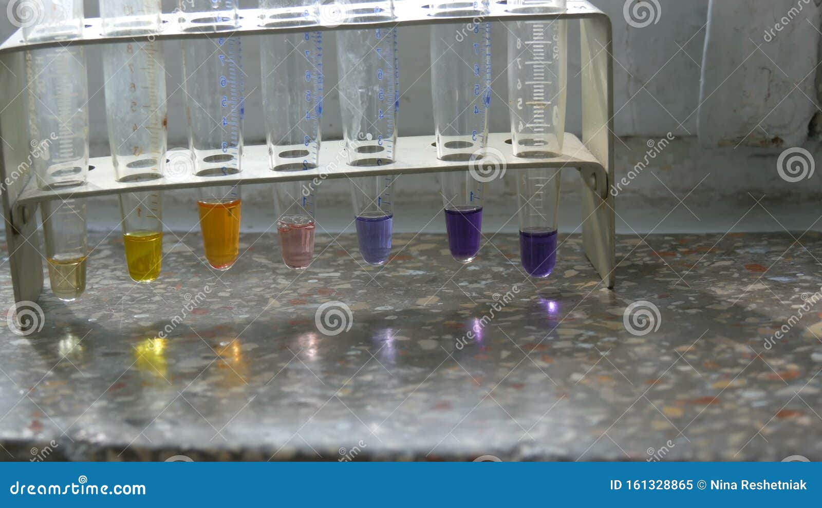 Colored Test Tubes in Laboratory on an Old Window with Marble Window
