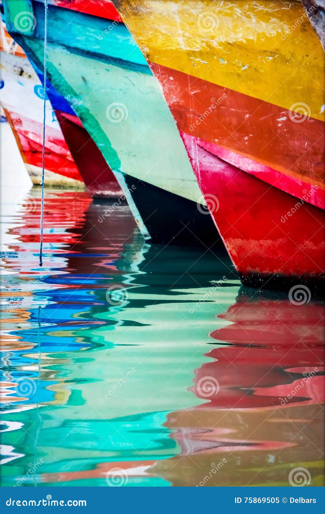 colored water reflections . colorful boats in the seaport .