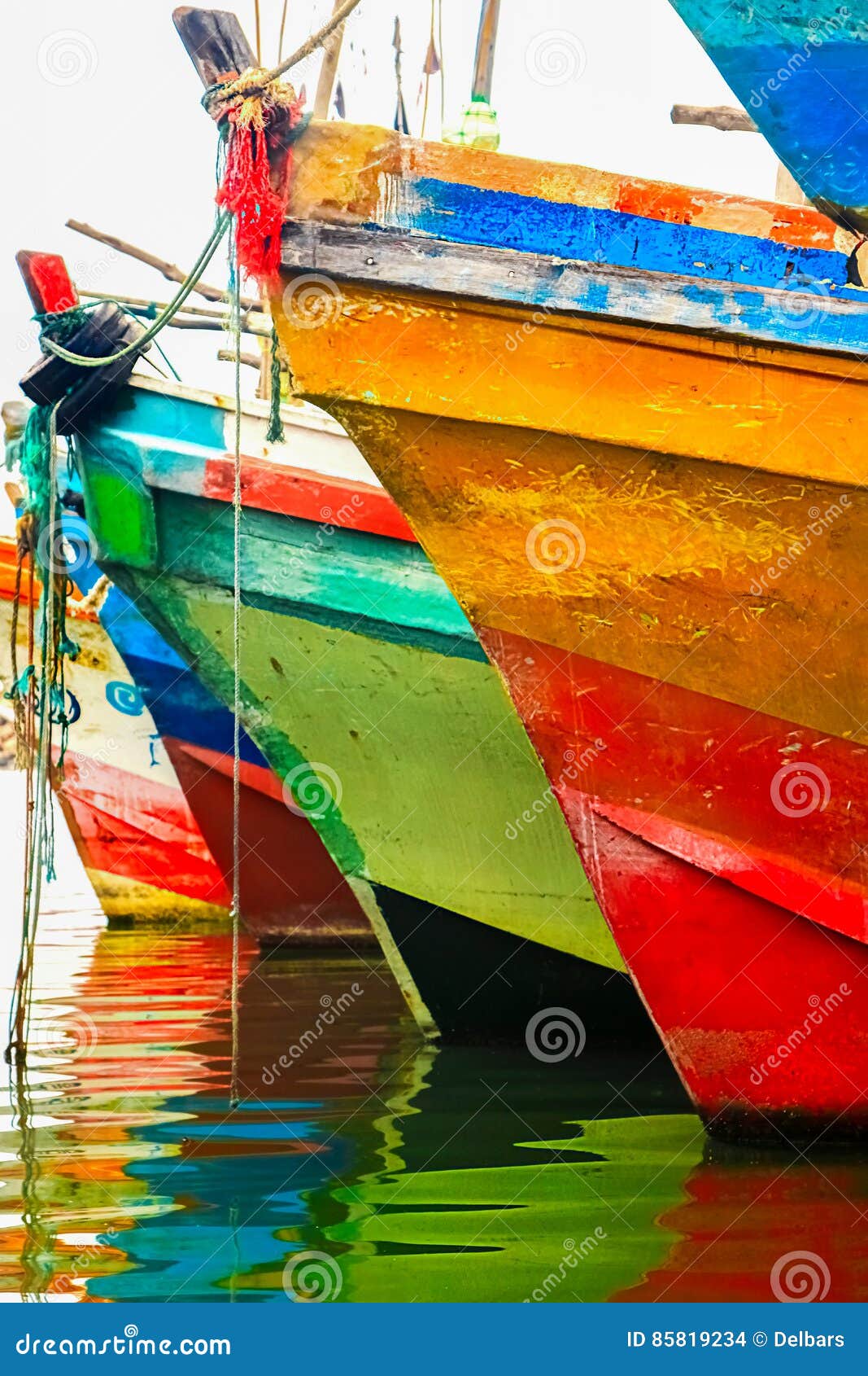 colored water reflections . colorful boats in the seaport .