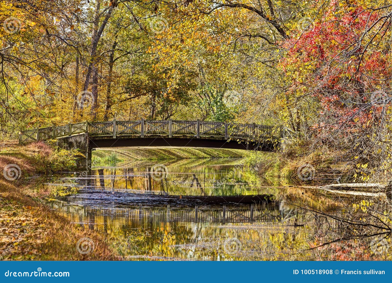 Colorful Autumn Foliage and Bridge Reflected in Water Stock Photo ...