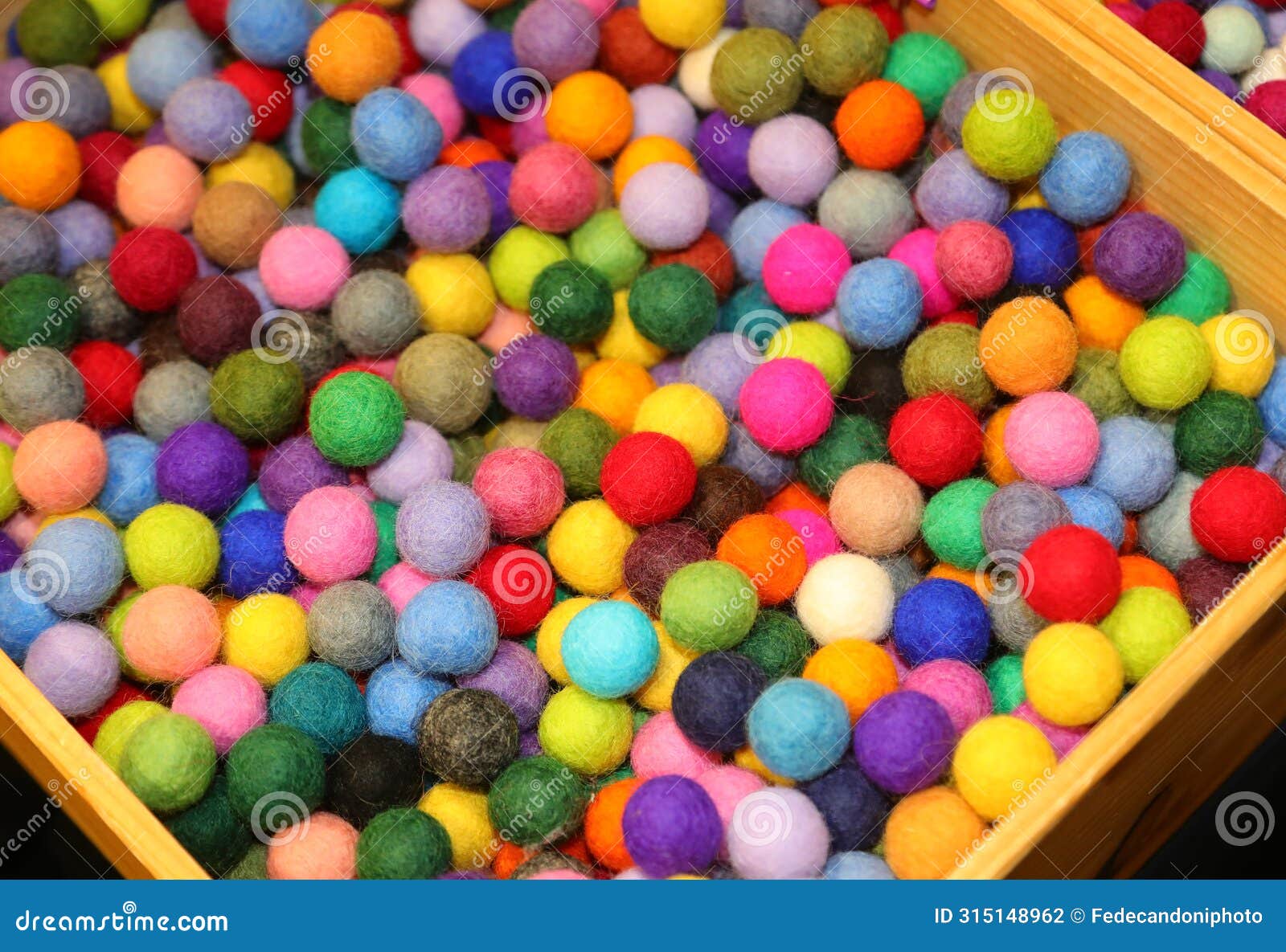 colorful balls made of boiled wool on sale in the hobby and pastime shop